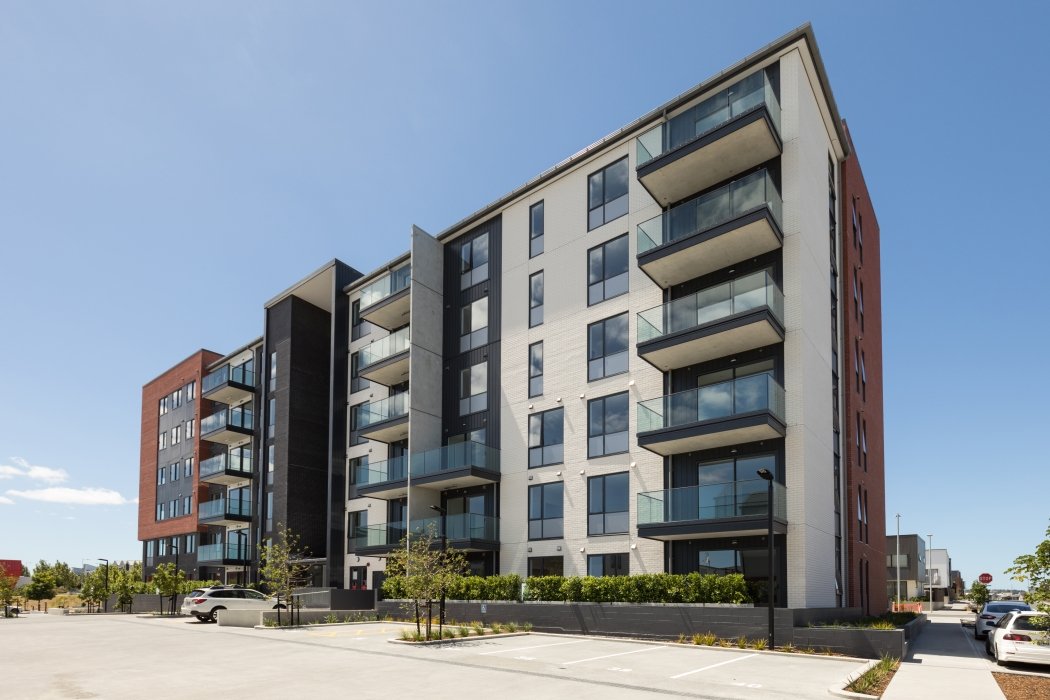 Uku Apartments, Auckland, New Zealand | This was a leaking 6-story apartment block in Hobsonville, Auckland. The cladding was partly brick veneer and metal cladding over timber framing in a concrete structure. The design did not cope with reasonable