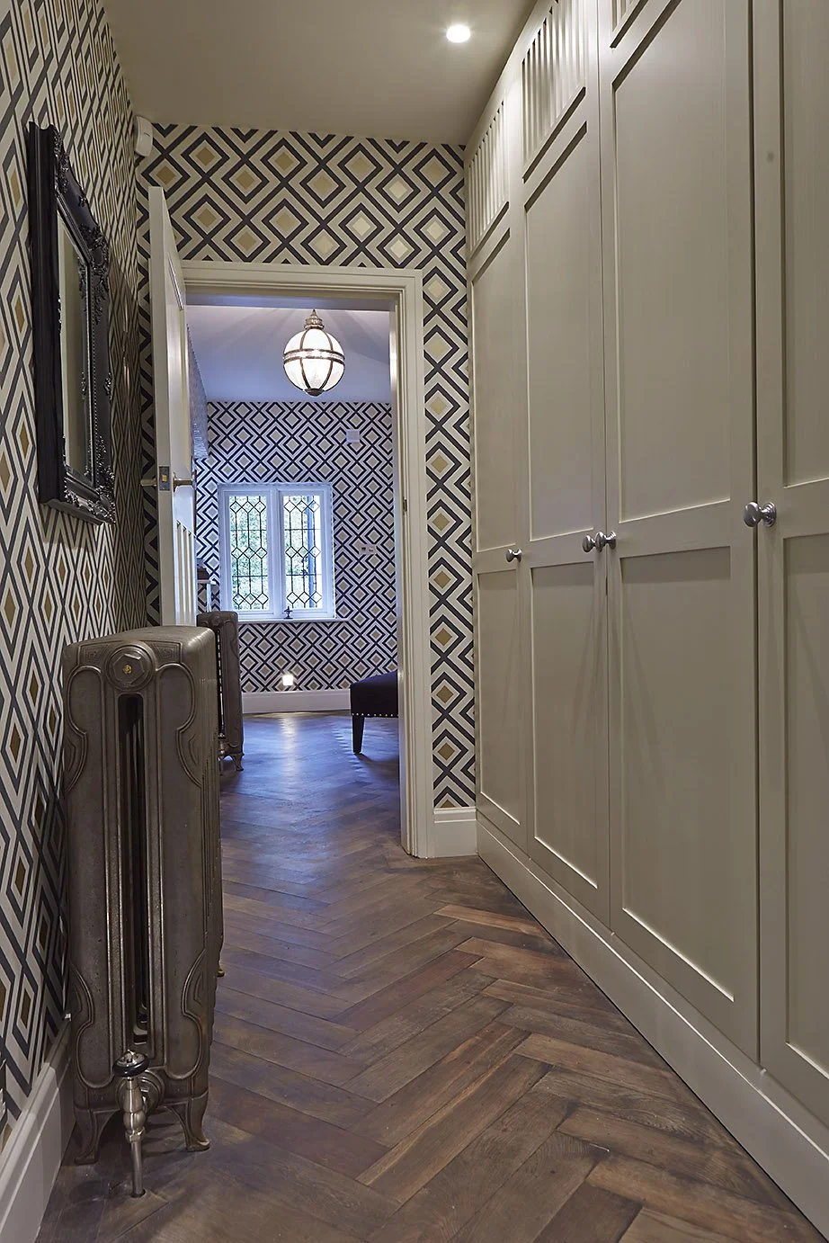 hallway showing herringbone wood floor