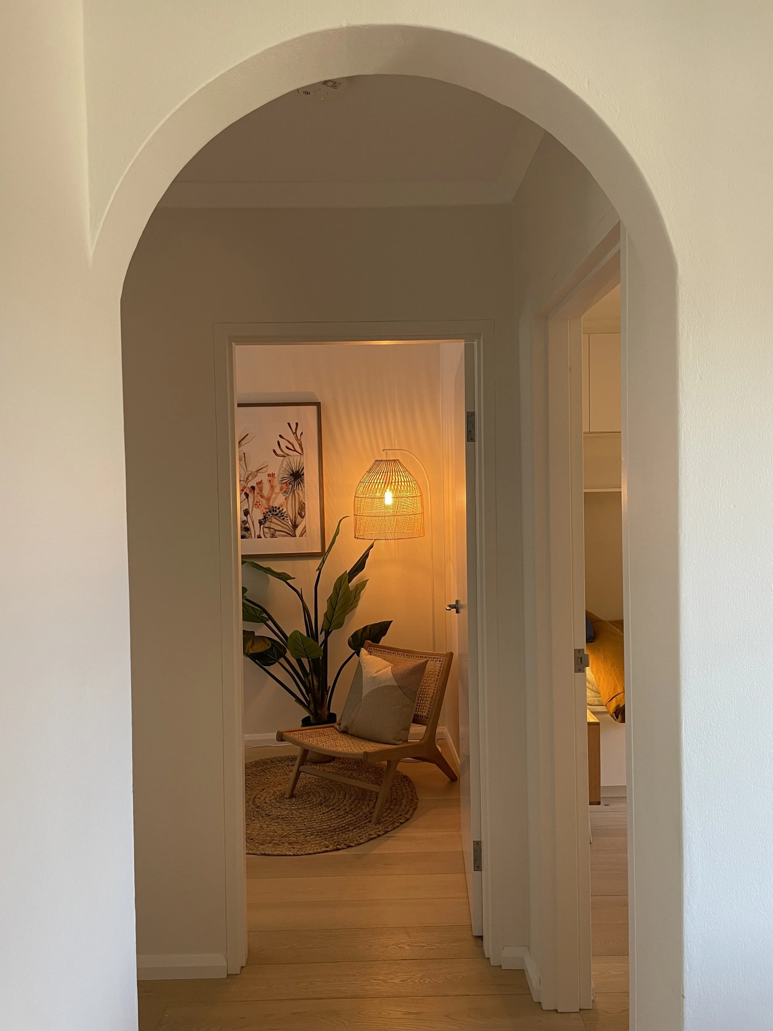 zoomed out view of hallway, showing the charm and character of this styled holiday home