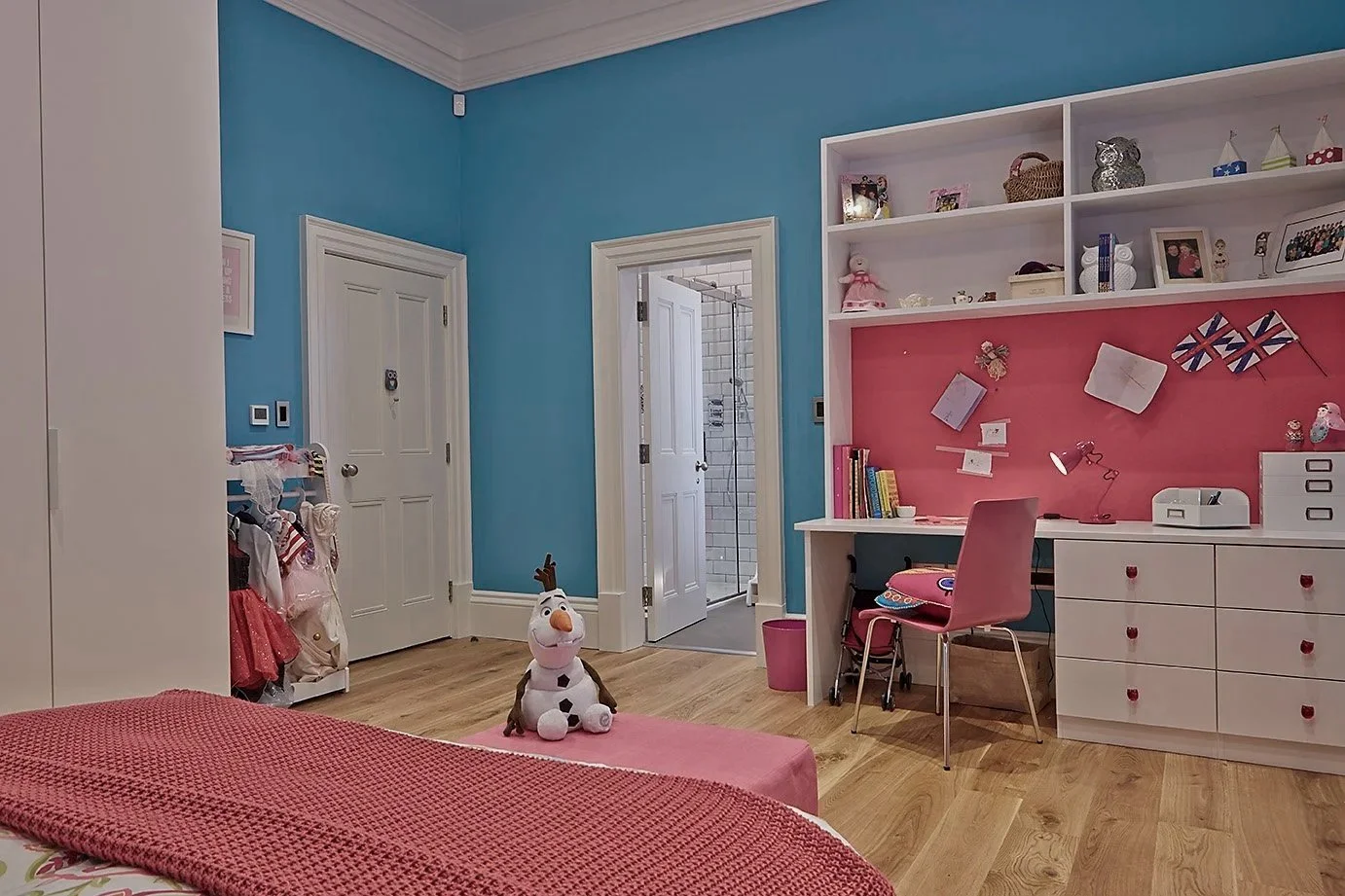 Child's study with pink and blue decoration. Contemporary interior design.