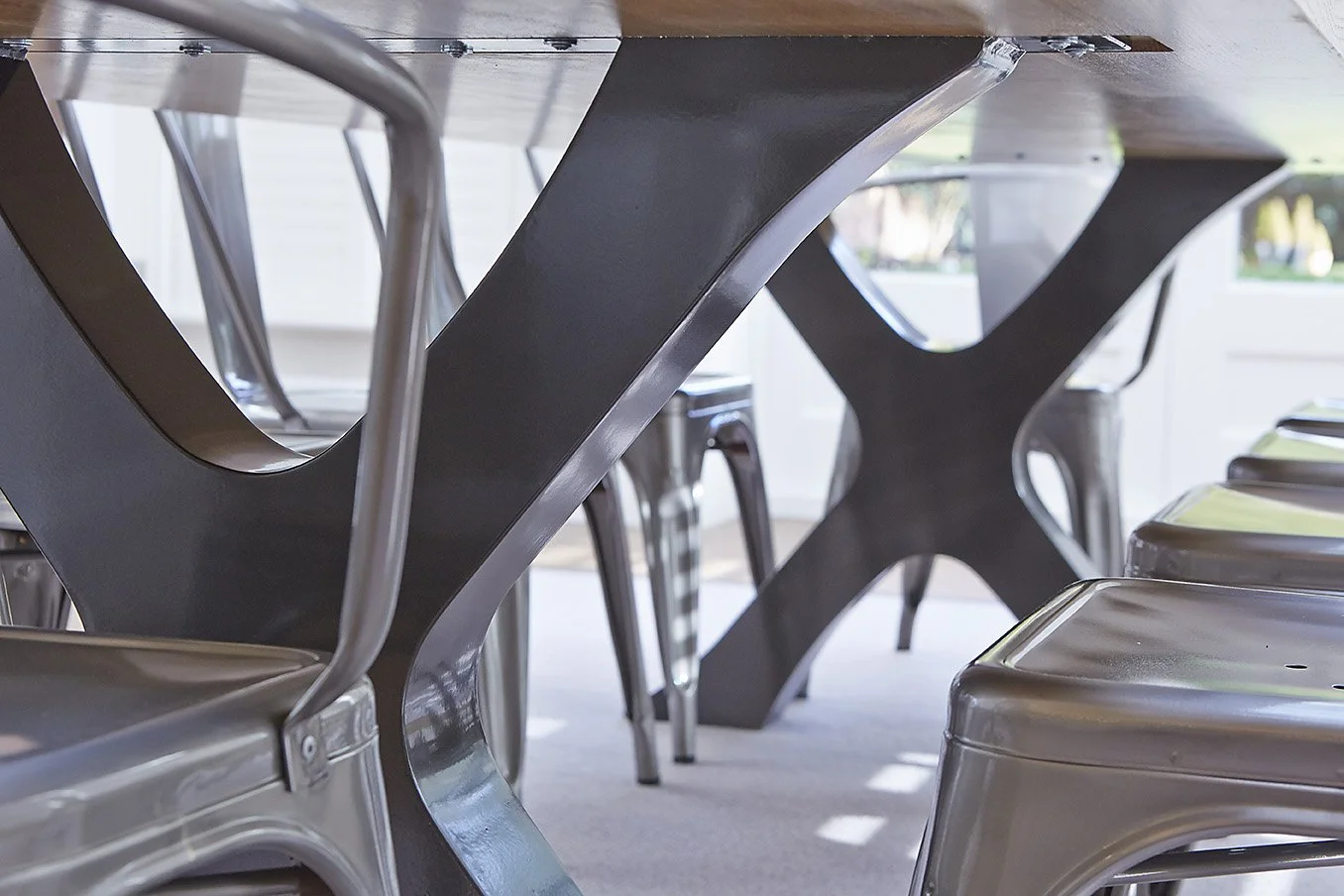 underside view of chrome and wooden table, modern design