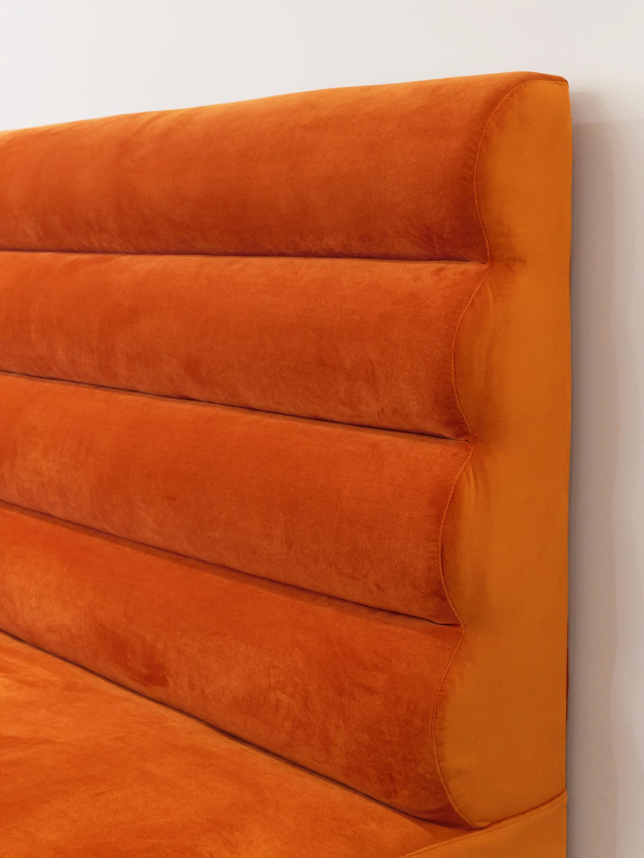 View of the texture on the big orange couch.