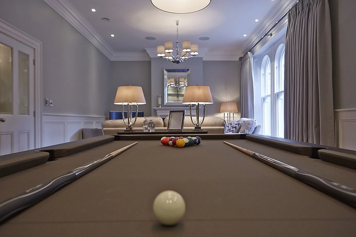 table-eye-view of the pool table in interior entertaining room