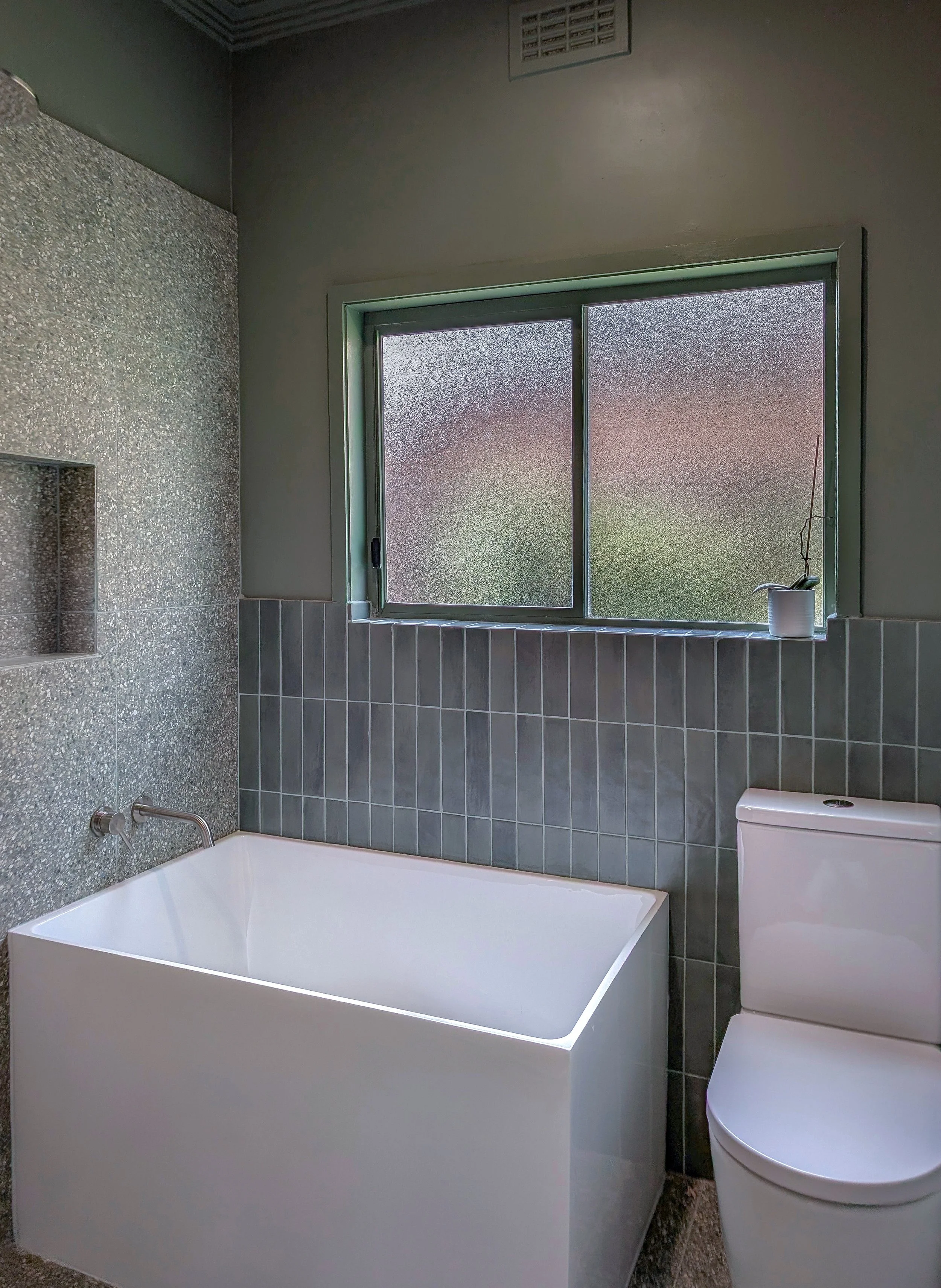 gentle green and white bathroom, Japanese tub, renovated bathroom in Brunswick Victoria 