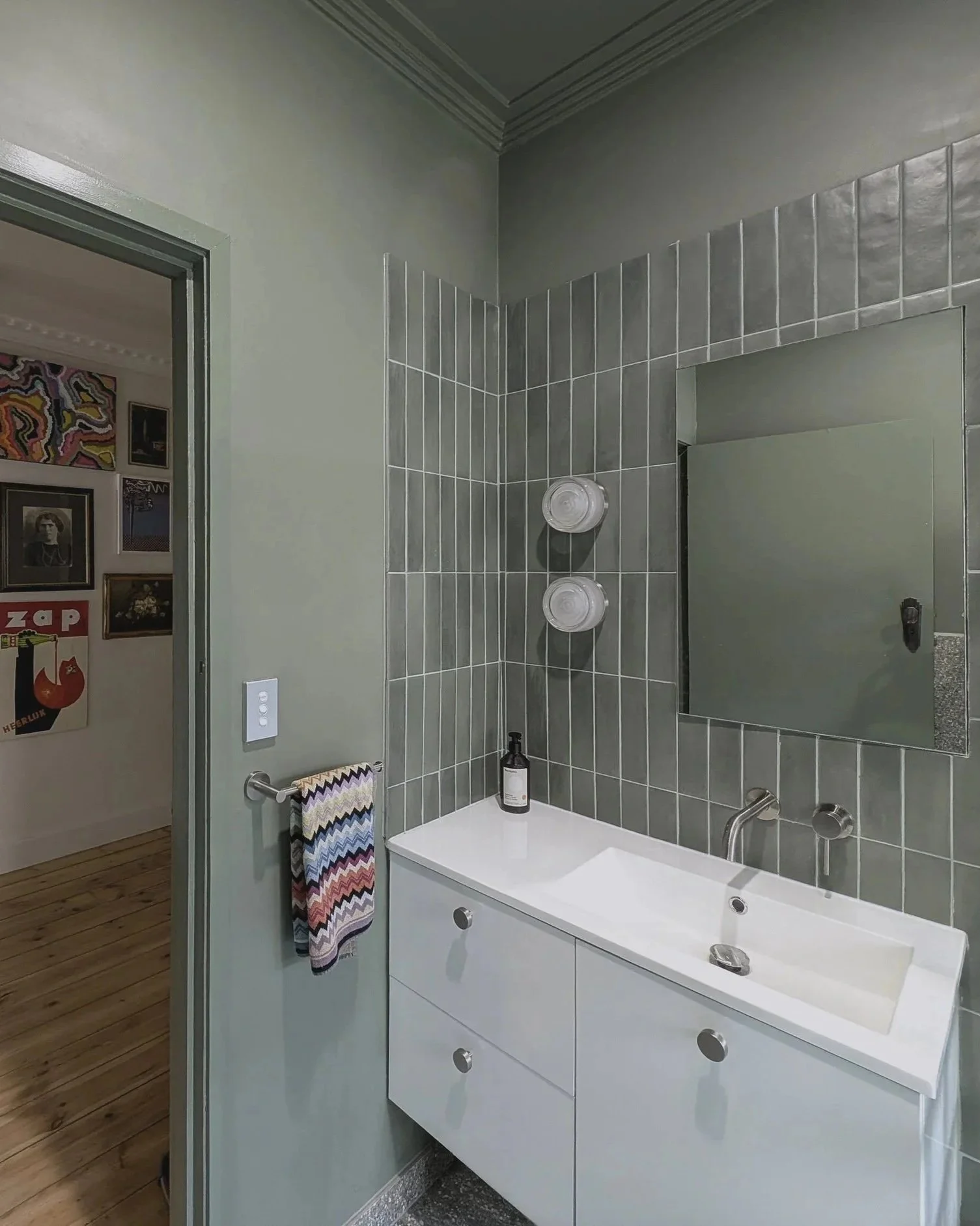 Interior design for bathroom in Brunsiwck house, soft sage green walls, modern fixtures.