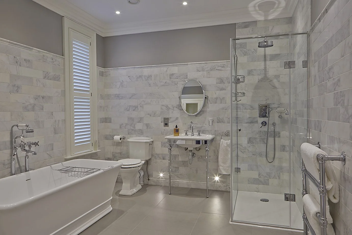 Warm white, modern bathroom in Victorian Style home interior design