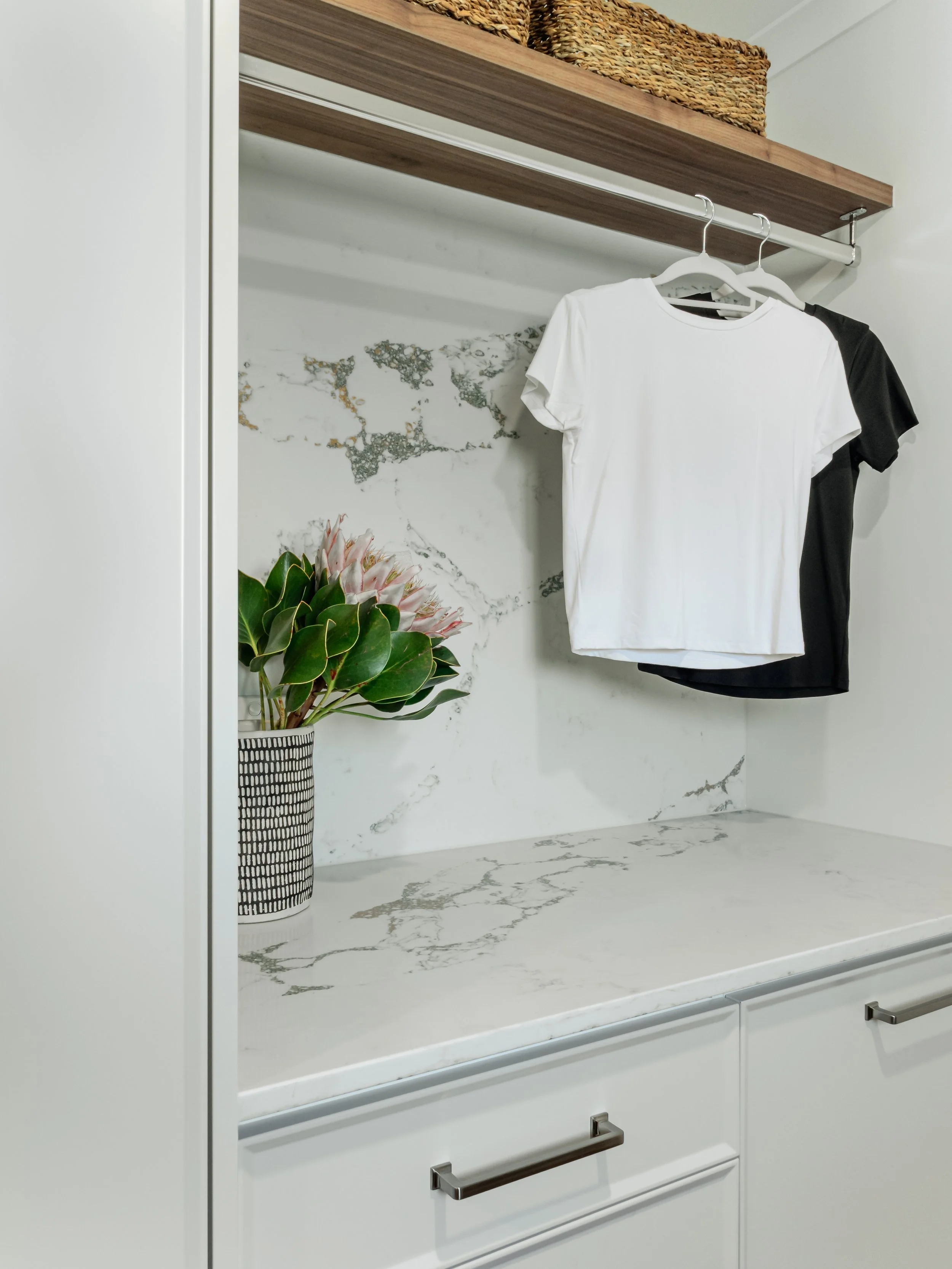wardrobe with stone top and white cabinets 