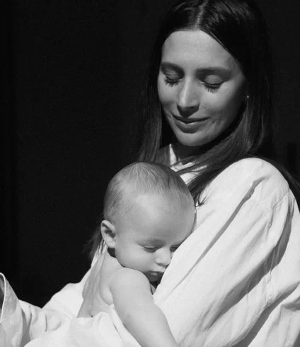 New mum participating in baby-friendly postnatal Pilates class in London, focused on core recovery, strength, and mobility.