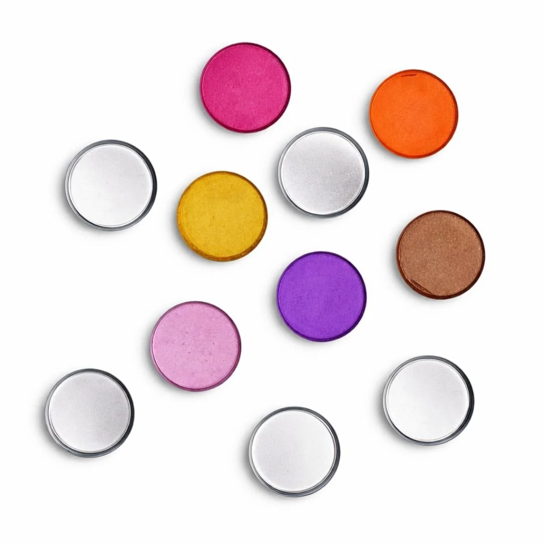 An assortment of 11 colorful round pills on a white background, including pink, orange, yellow, purple, brown, and white pills.