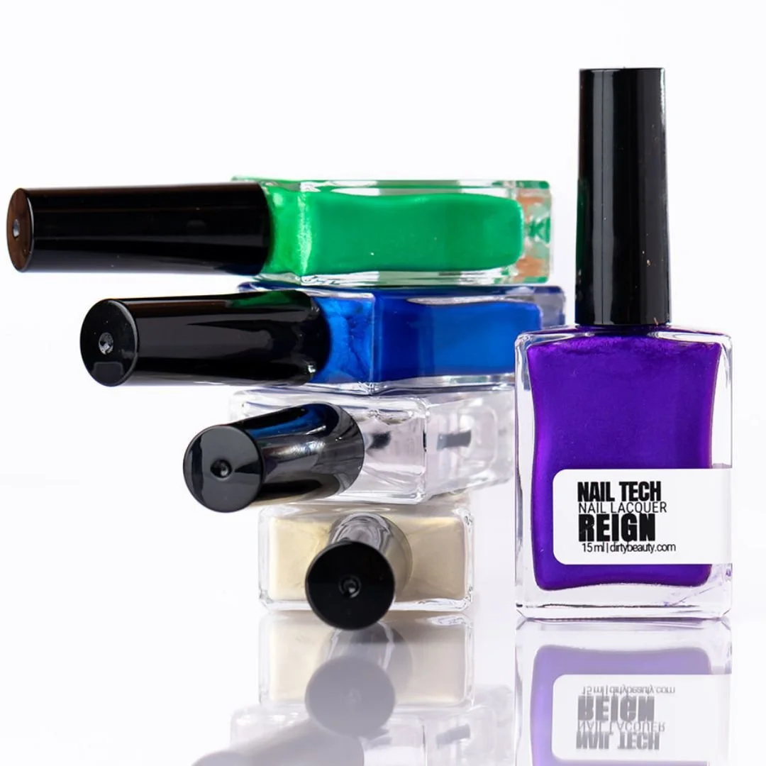 Four bottles of nail polish in green, blue, clear, and purple colors arranged vertically, with the purple bottle labeled 'NAIL TECH REIGN' and a white background.