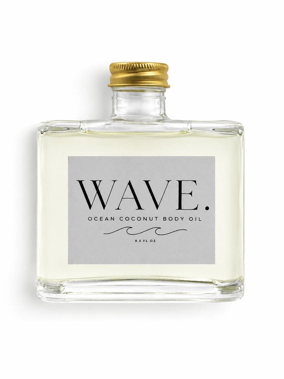 A clear glass bottle with a gold cap, labeled 'WAVE. Ocean Coconut Body Oil.'