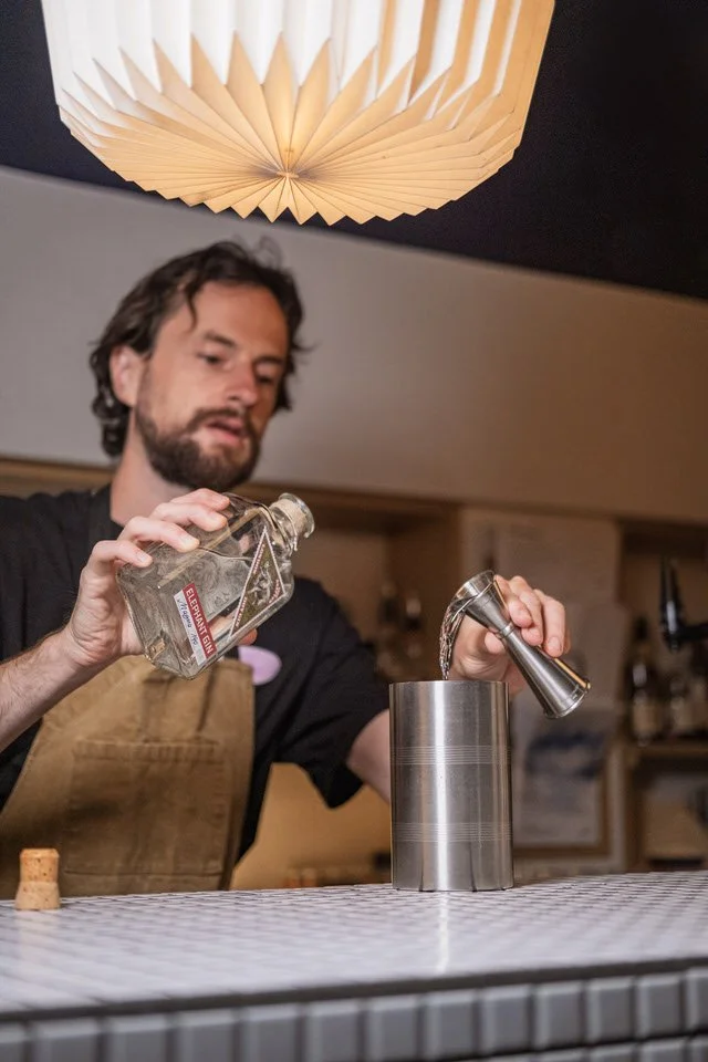 Bartender preparing cocktails at a London event