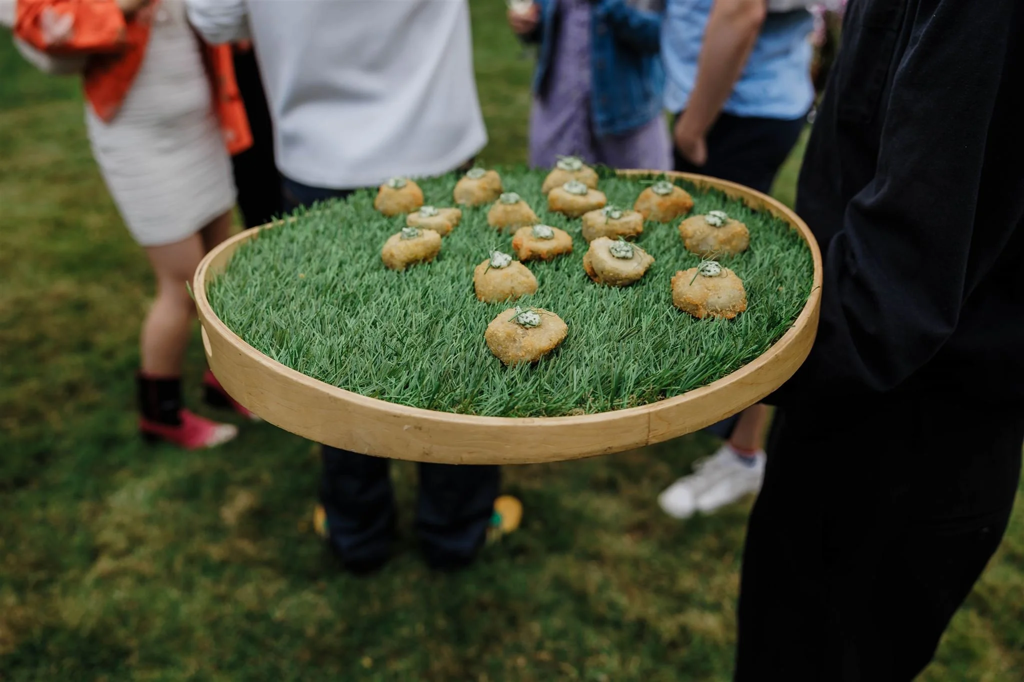 Canapes being circulated at a summer garden party