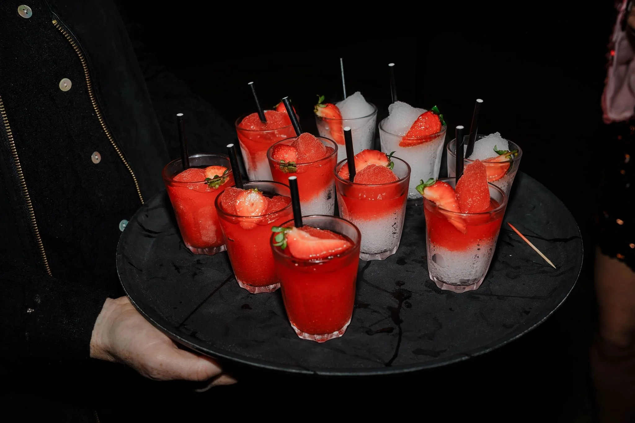 A tray of slushy cocktails at a summer garden party in London