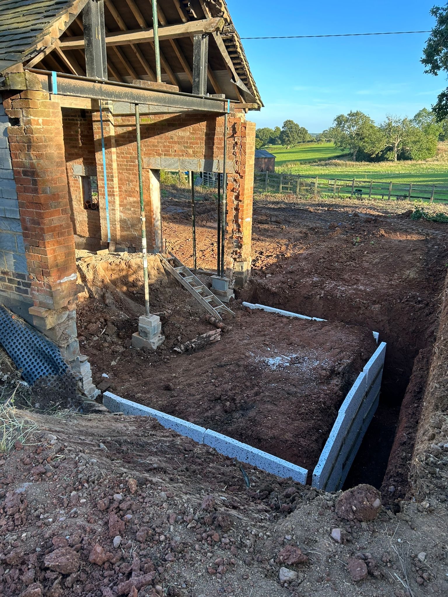 Brick barn conversion with temporary propping during structural works