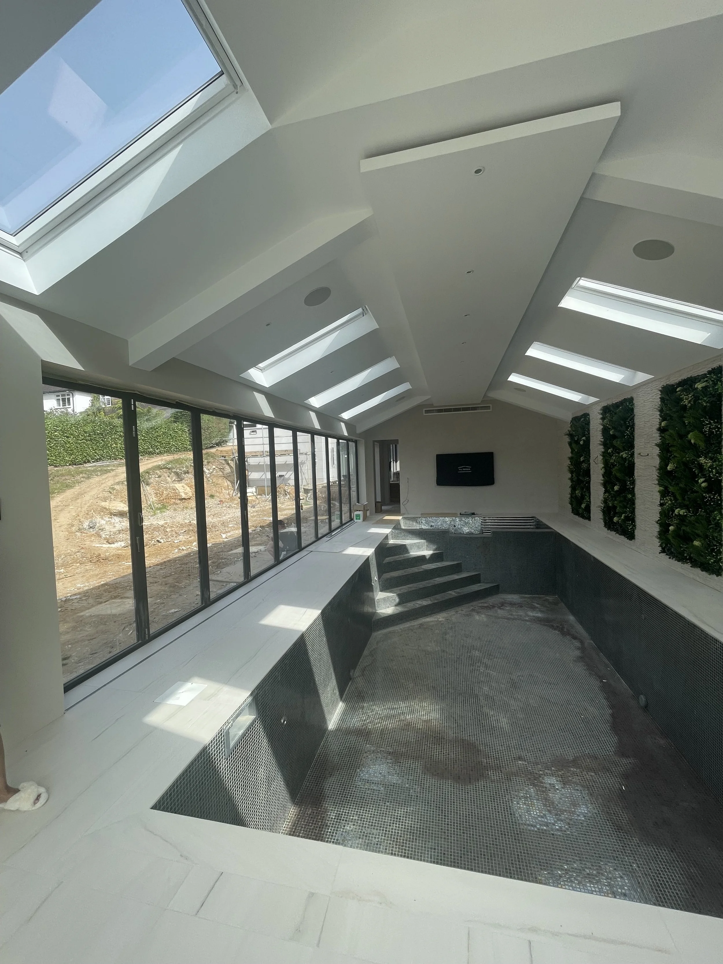 Vaulted extension ceiling with rooflights and a concealed steel beam