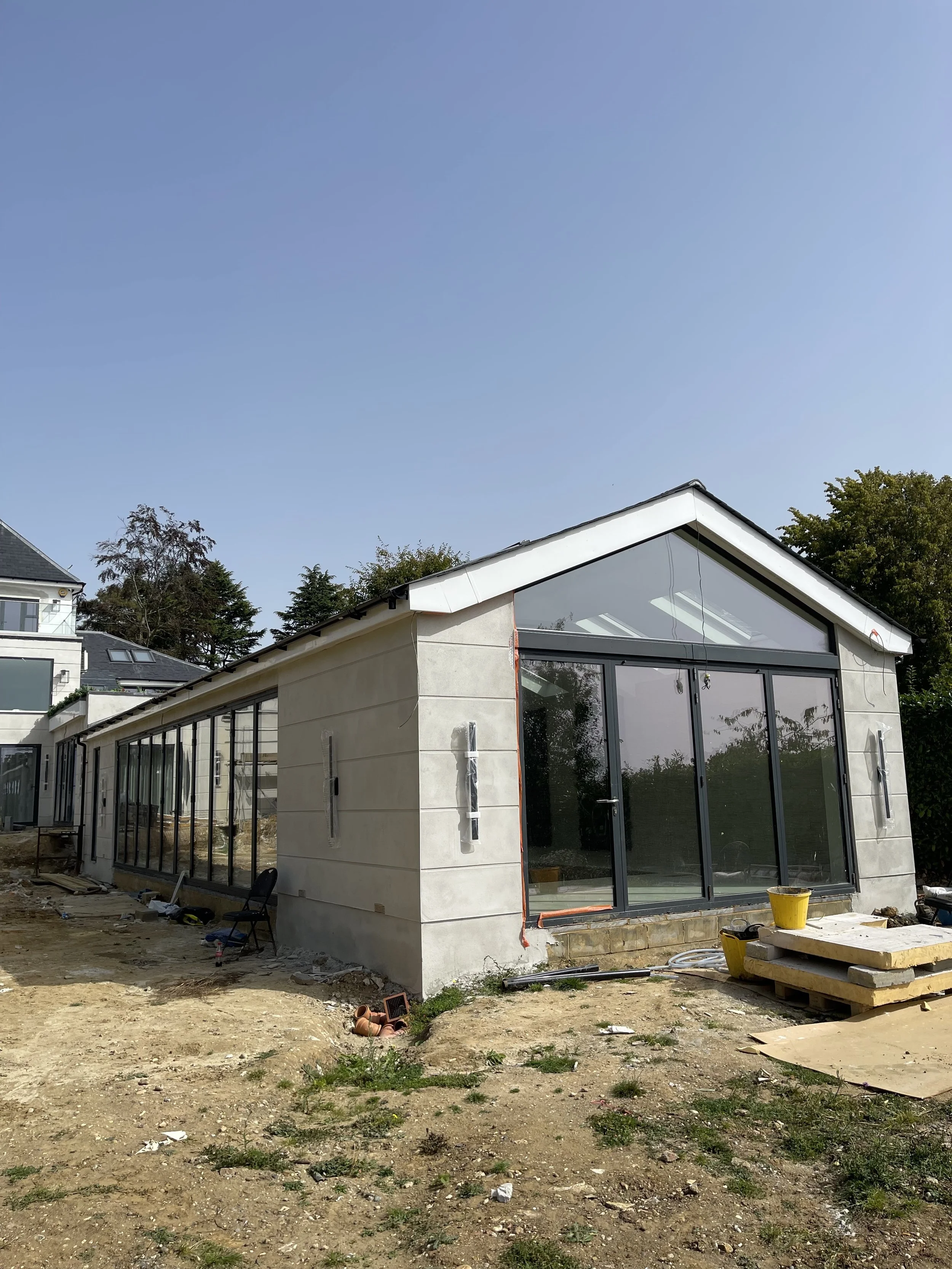 Completed single-storey rear extension with a glazed gable end