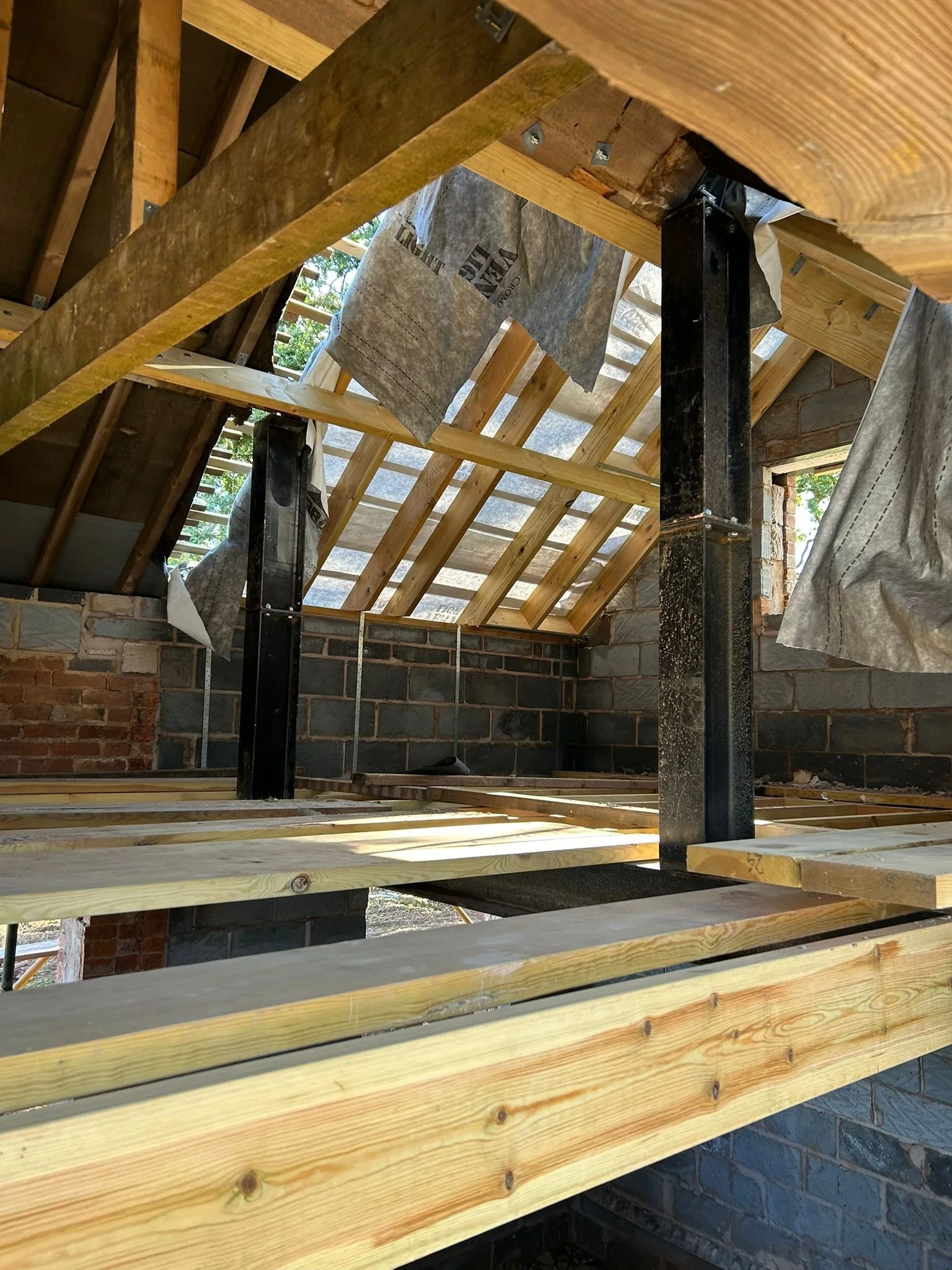 Steel posts and new timber floor joists installed in a loft conversion