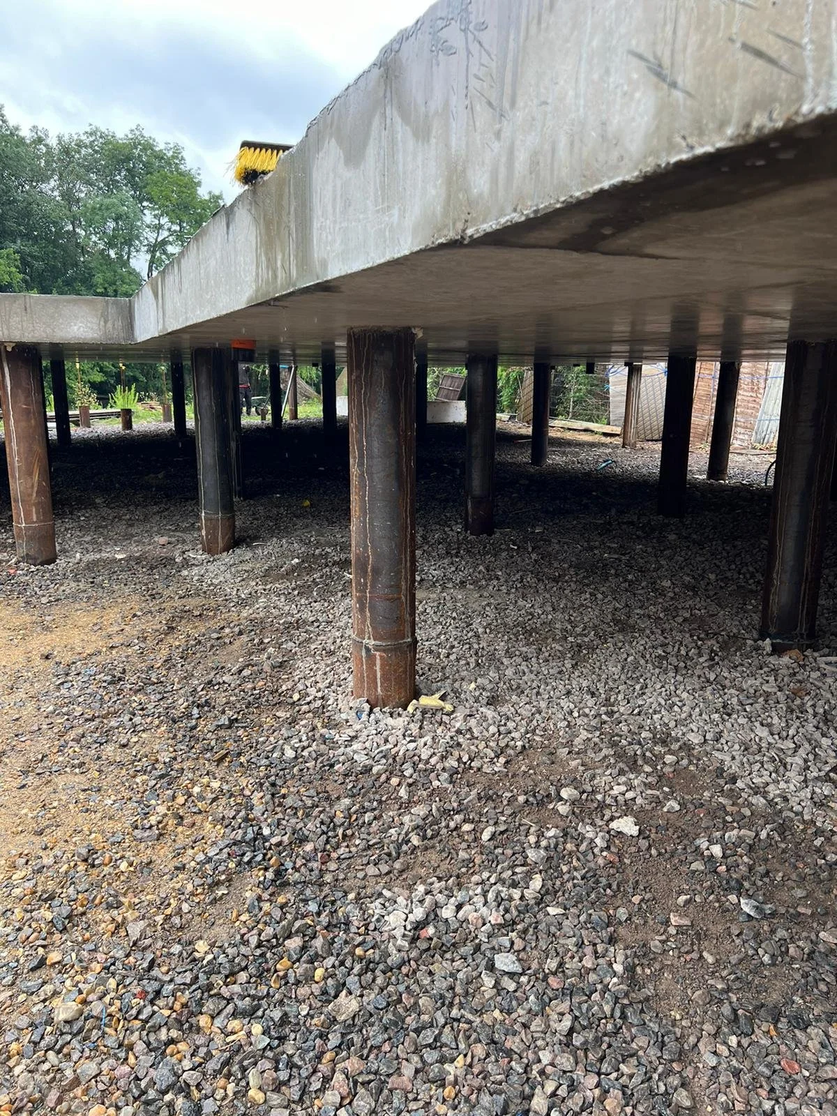 Suspended reinforced concrete slab on 219mm steel-cased driven piles, Shepperton
