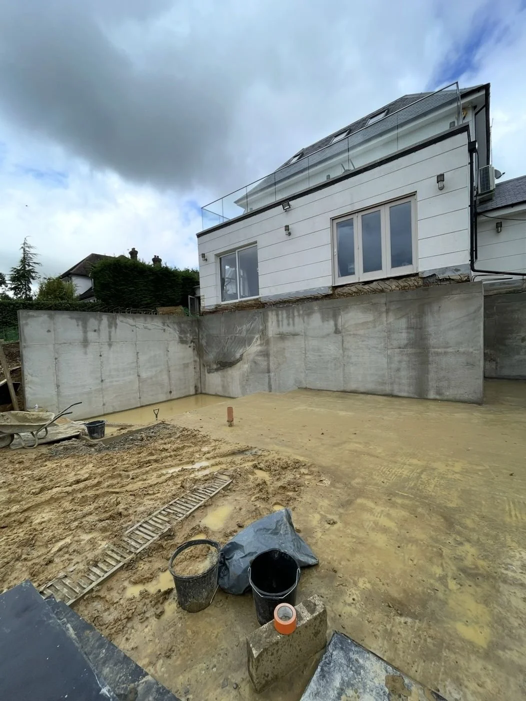 Reinforced concrete retaining walls for a lower ground floor, Matlock