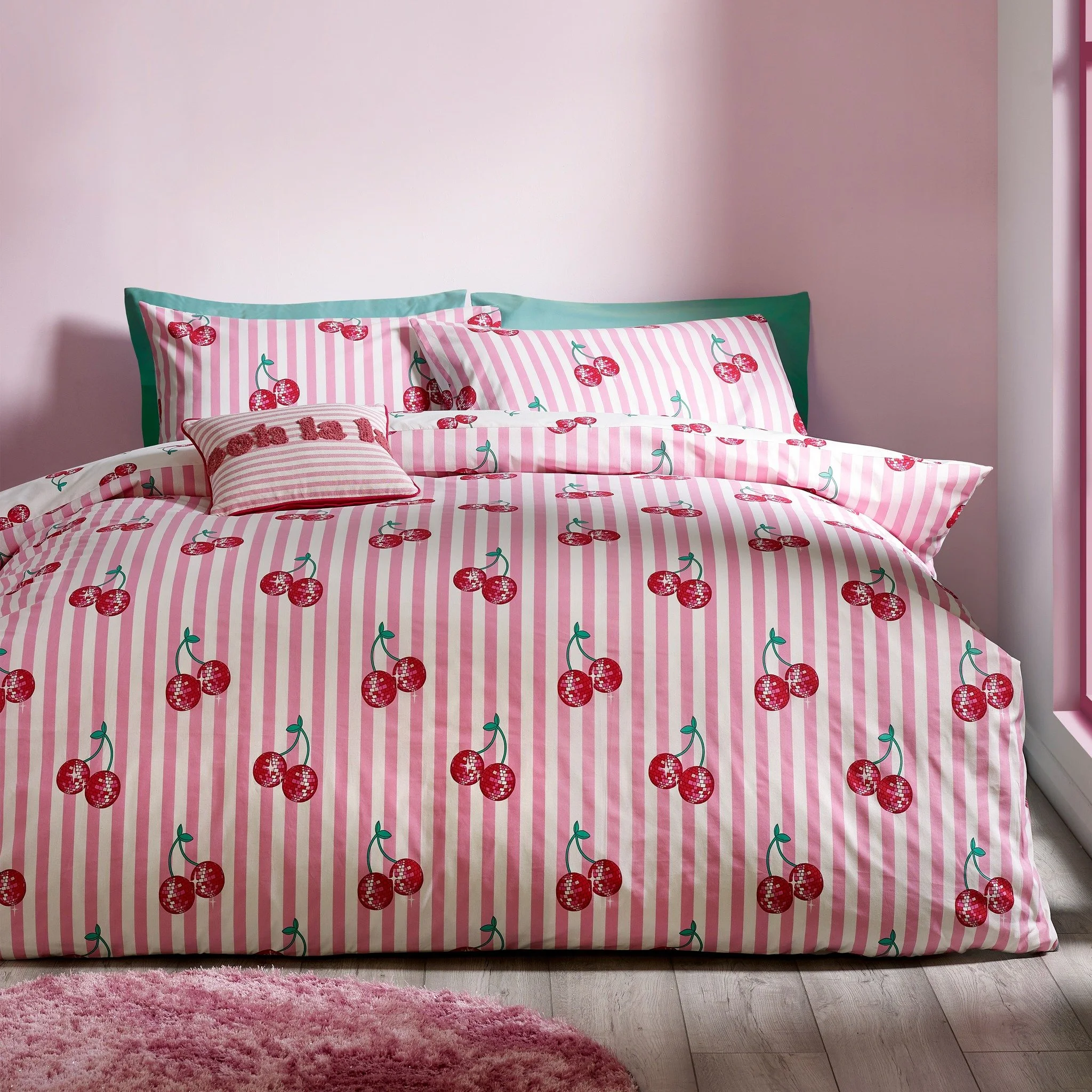 Turn up the charm with a little retro sparkle 🍒✨

Bold pink stripes and disco ball cherries bring playful energy to your bedroom, with a fully reversible design for two fun looks in one.
Easy-care comfort made for everyday living.

#CatherineLansfie