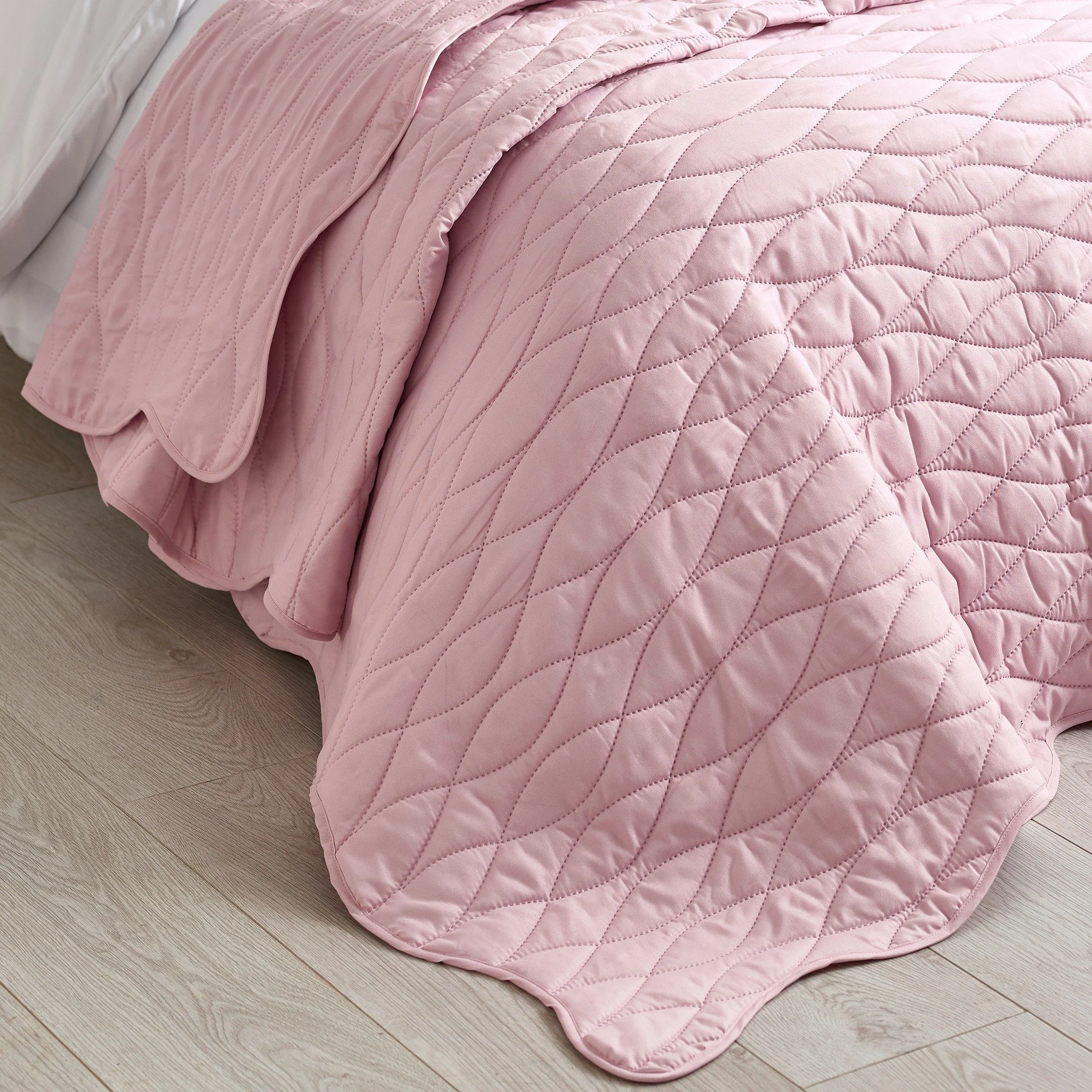 Refresh your bedroom with this playful bedspread, featuring a scalloped edge and pinsonic quilted texture for the perfect layering statement.

#CatherineLansfield #CatherineLansfieldHome #BedroomRefresh #QuiltedStyle #ScallopEdge #LayeredLook #HomeIn