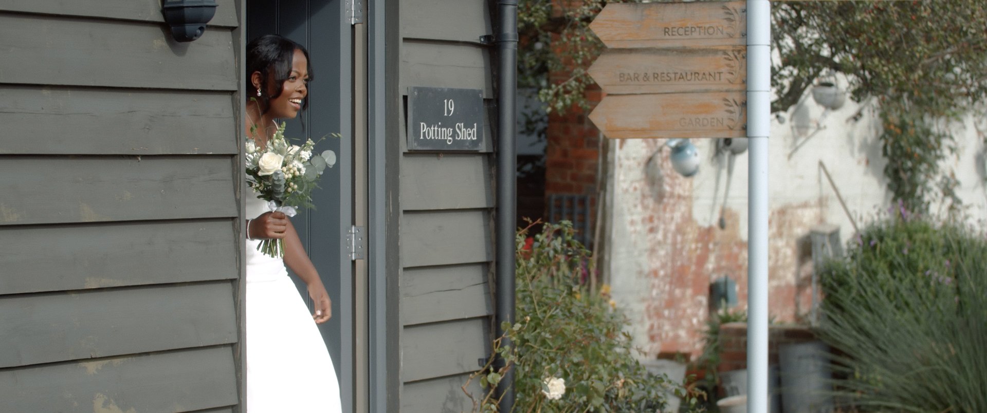Bride exits potting shed at Titchwell Manor, Norfolk
