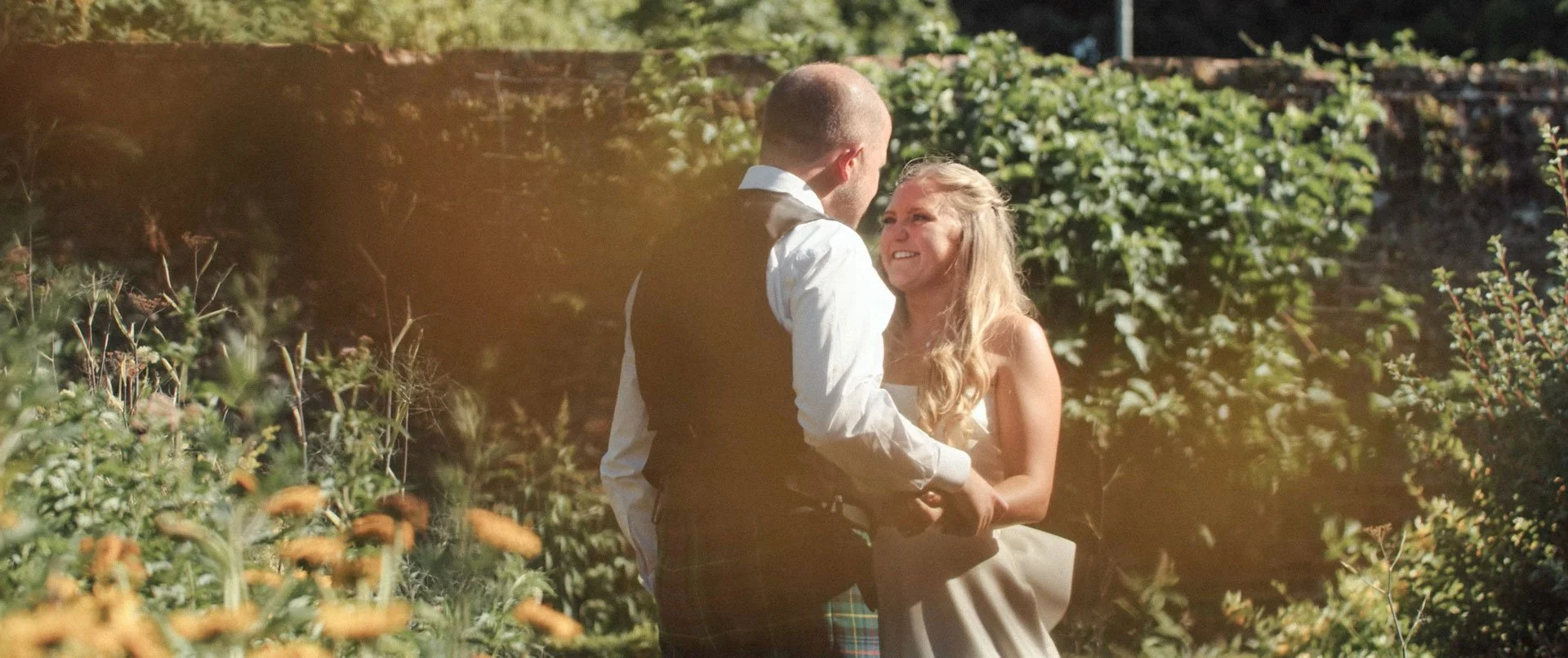 Newly married couple in the gardens at Hockwold Hall