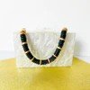 Mollybeads clutch handle black and gold.jpg