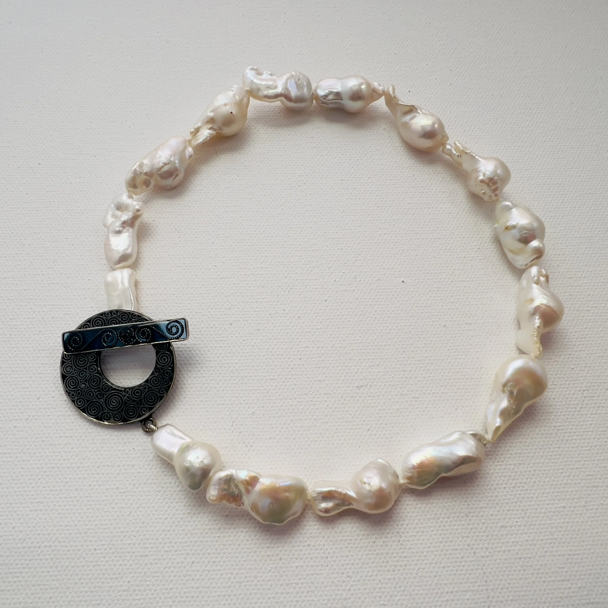 A Bold Clasp for Timeless Pearls