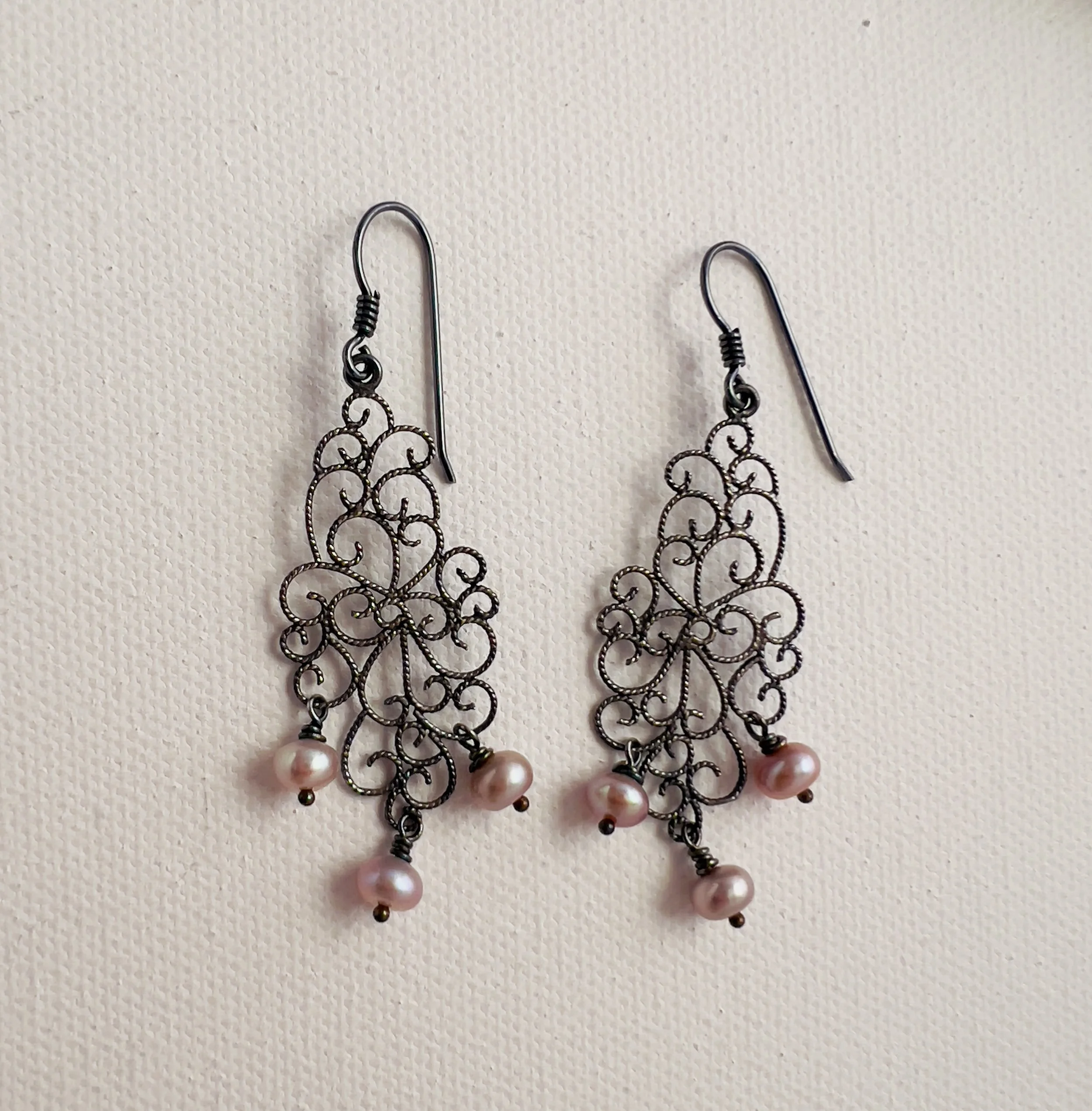 Pearls dancing on silver earrings