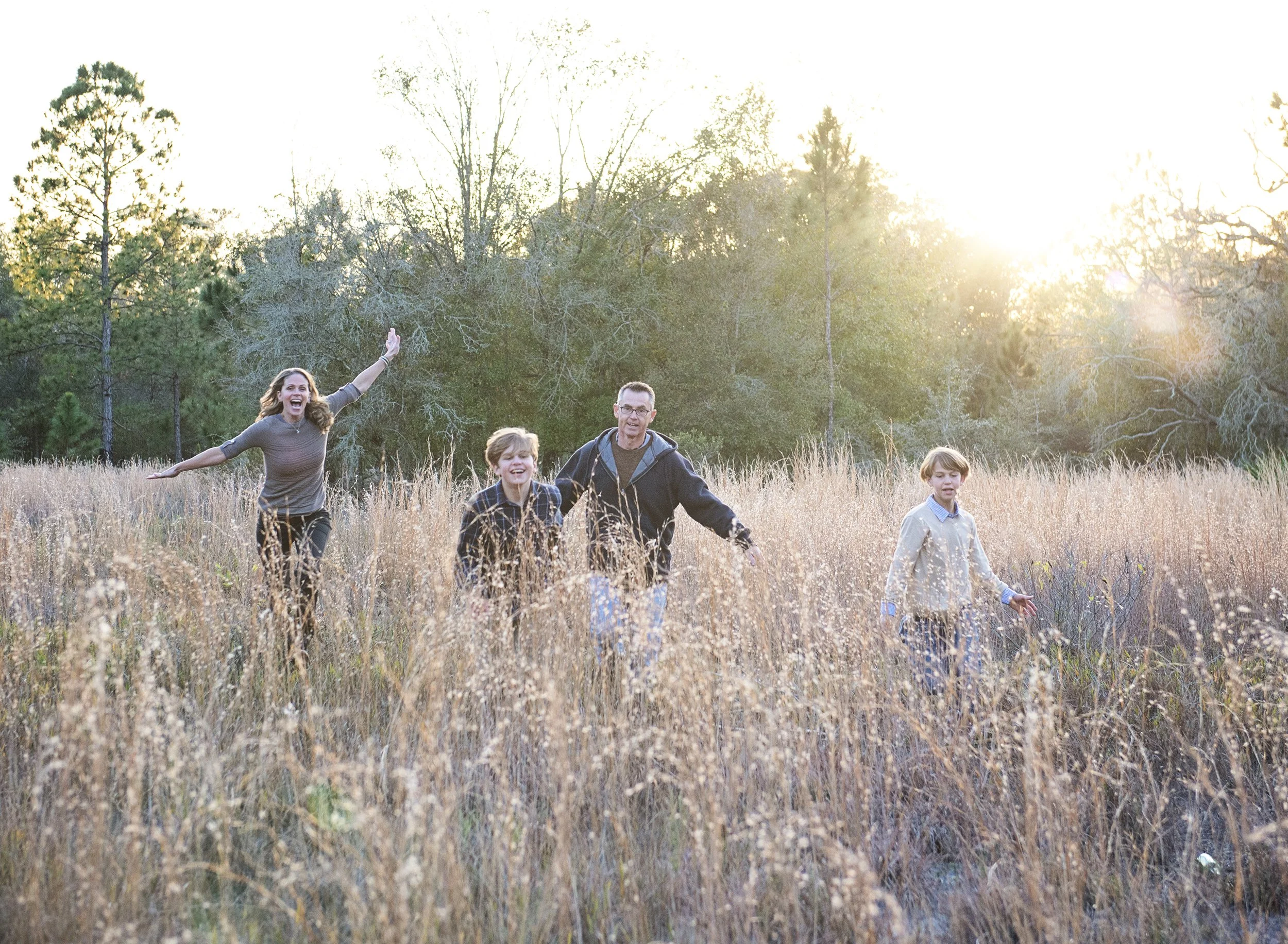 Fun candid family photo session in Tampa FL with kids playing and laughing outdoors