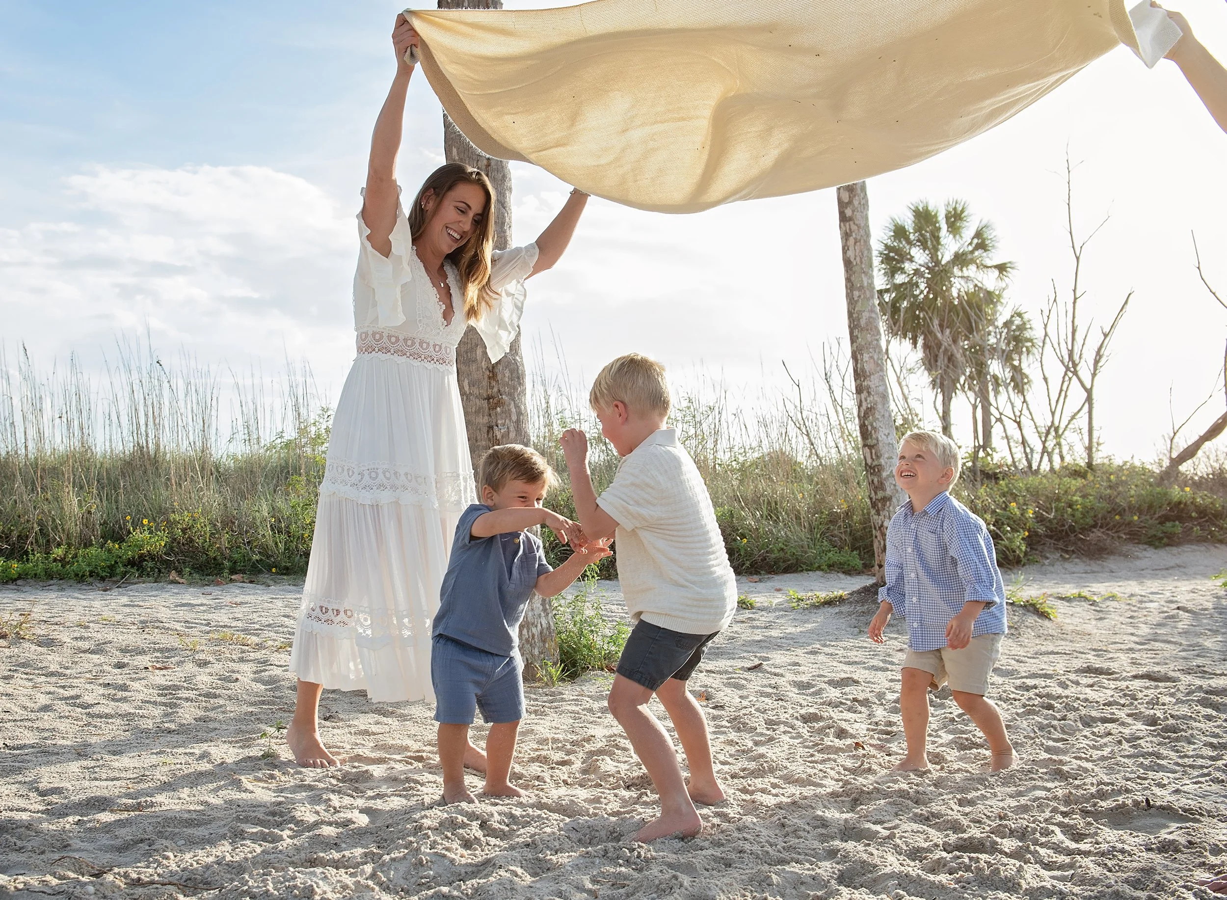 Kids laughing and playing during a relaxed family photo session in Tampa, FL