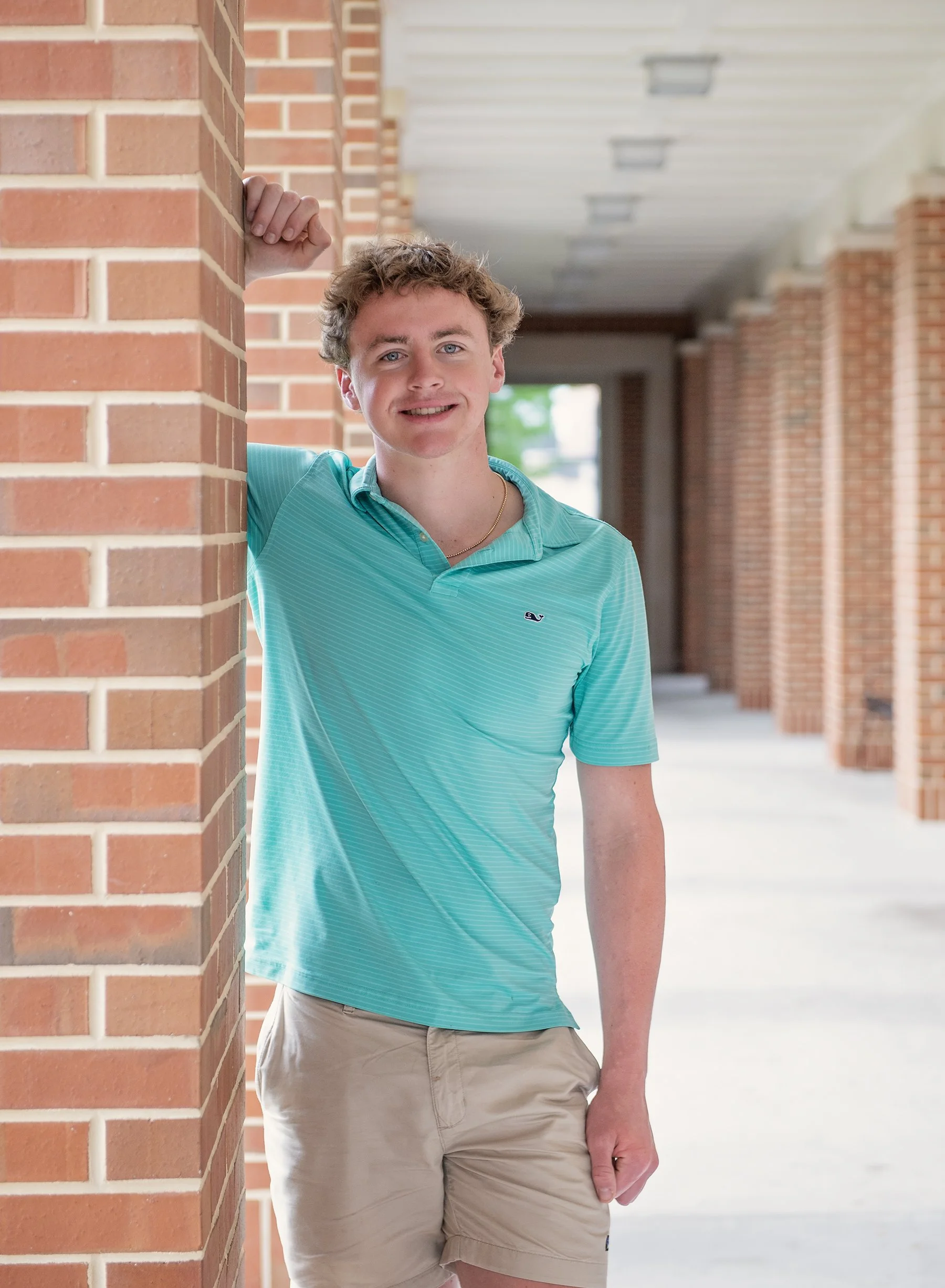 Teen boy in green shirt at Jesuit High School in Tampa