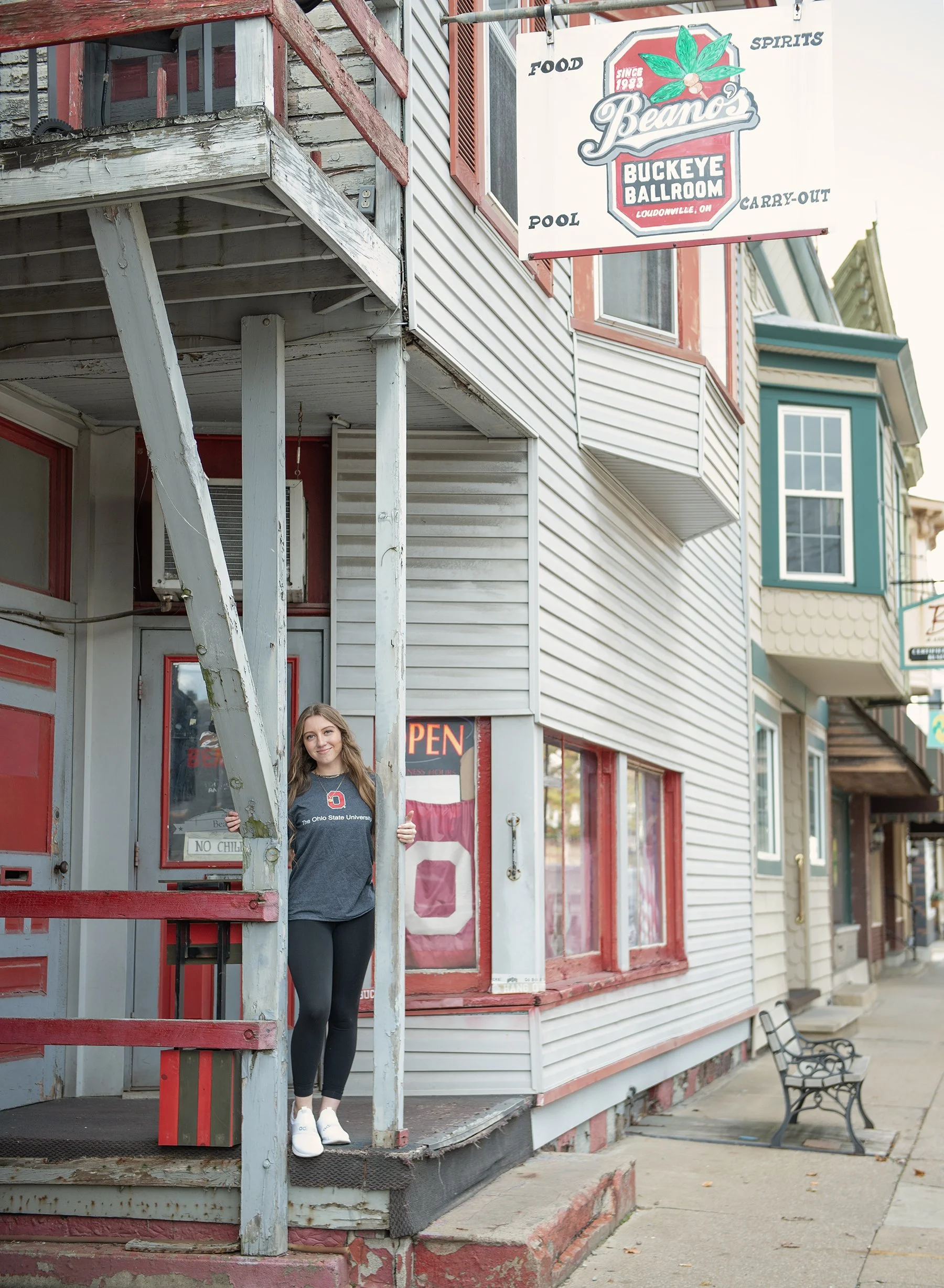 Teen girl standing outside college store