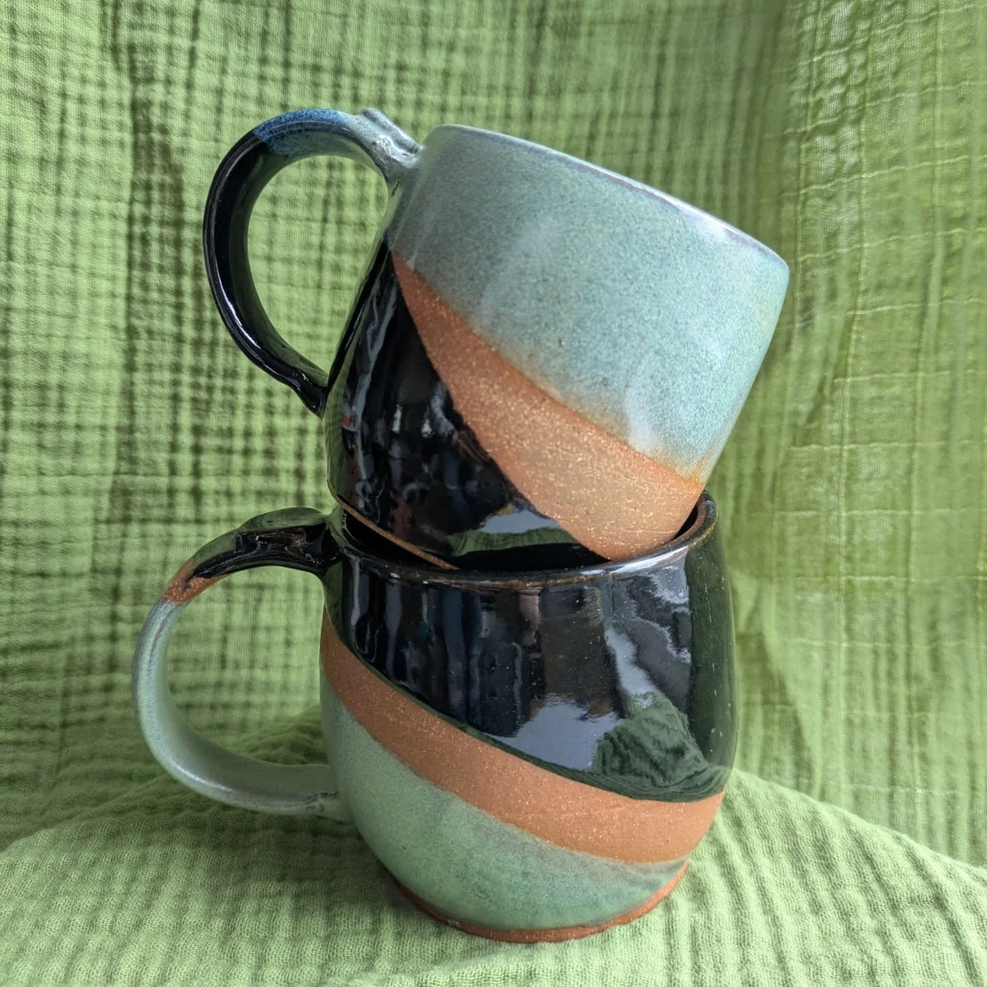 Matching mugs of jade and licorice