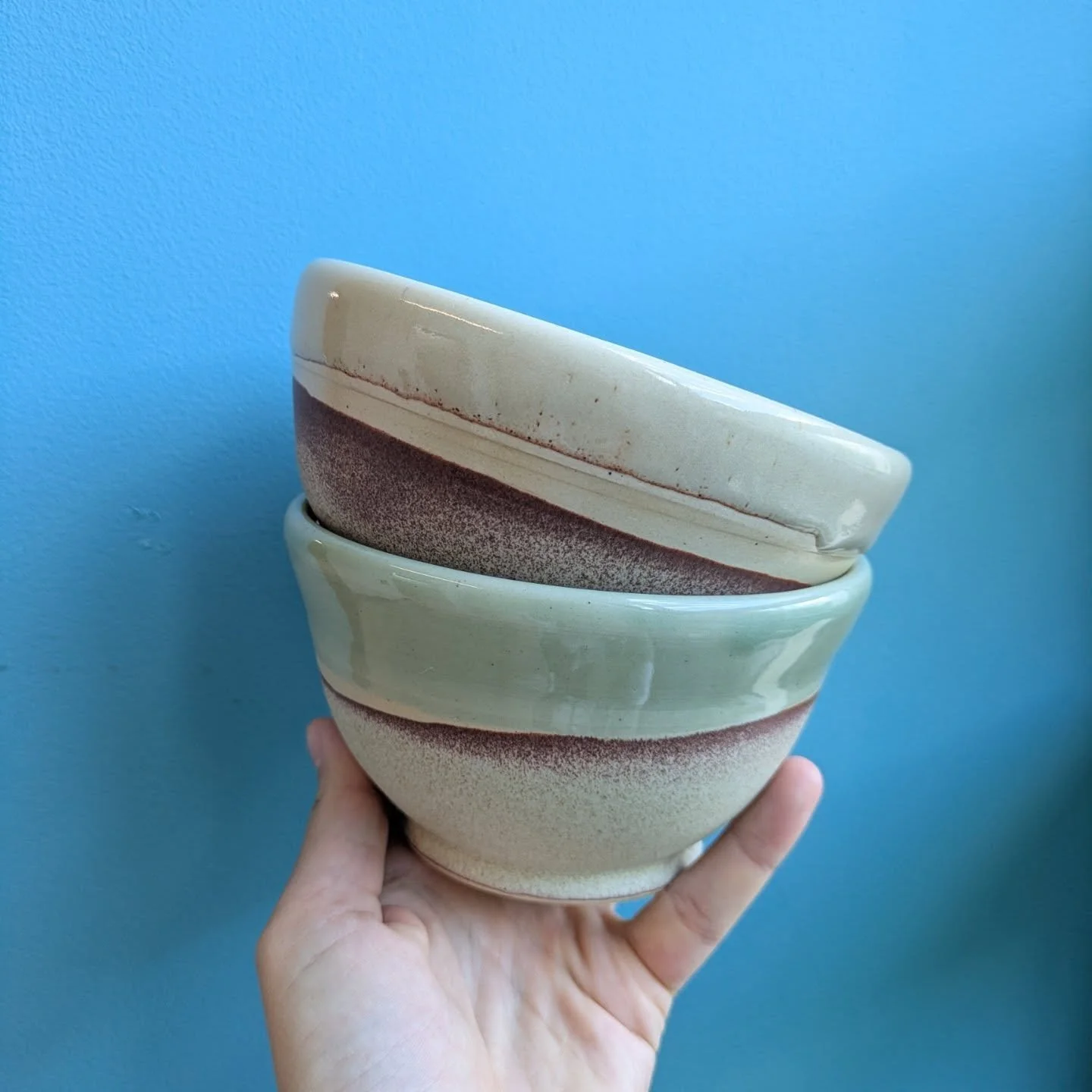 Shino, celadon, and birds matte orange on white clay