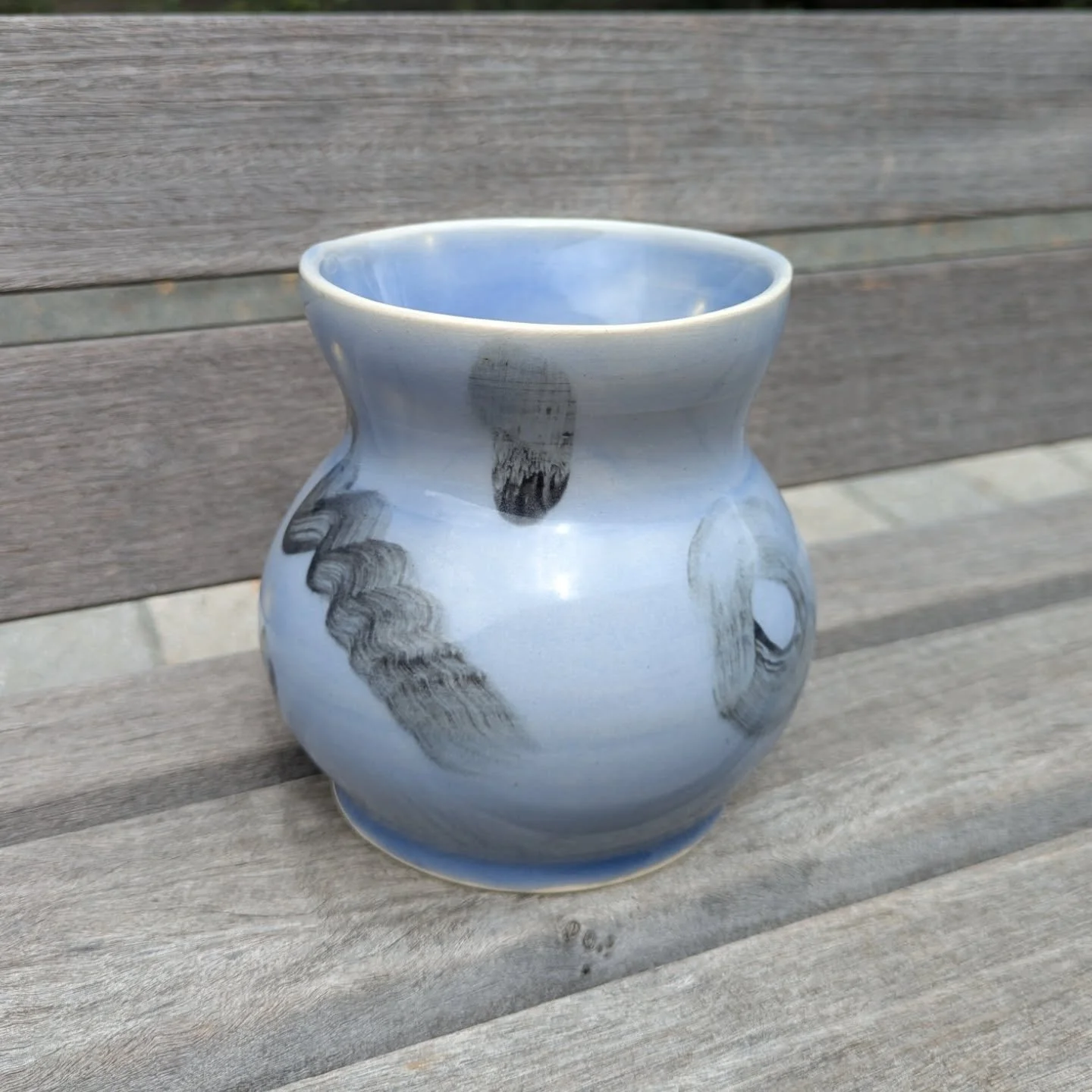 Black slip on white clay with blue celadon