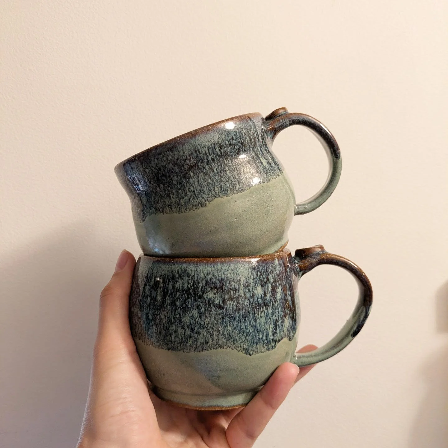 Jade and golden celadon on brown clay