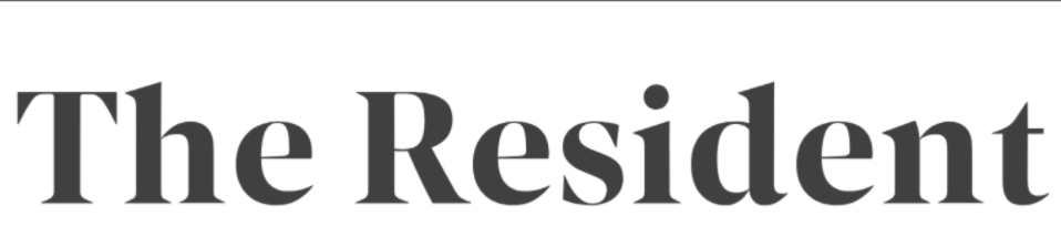 Text reading 'The Resident' in large, bold black font.