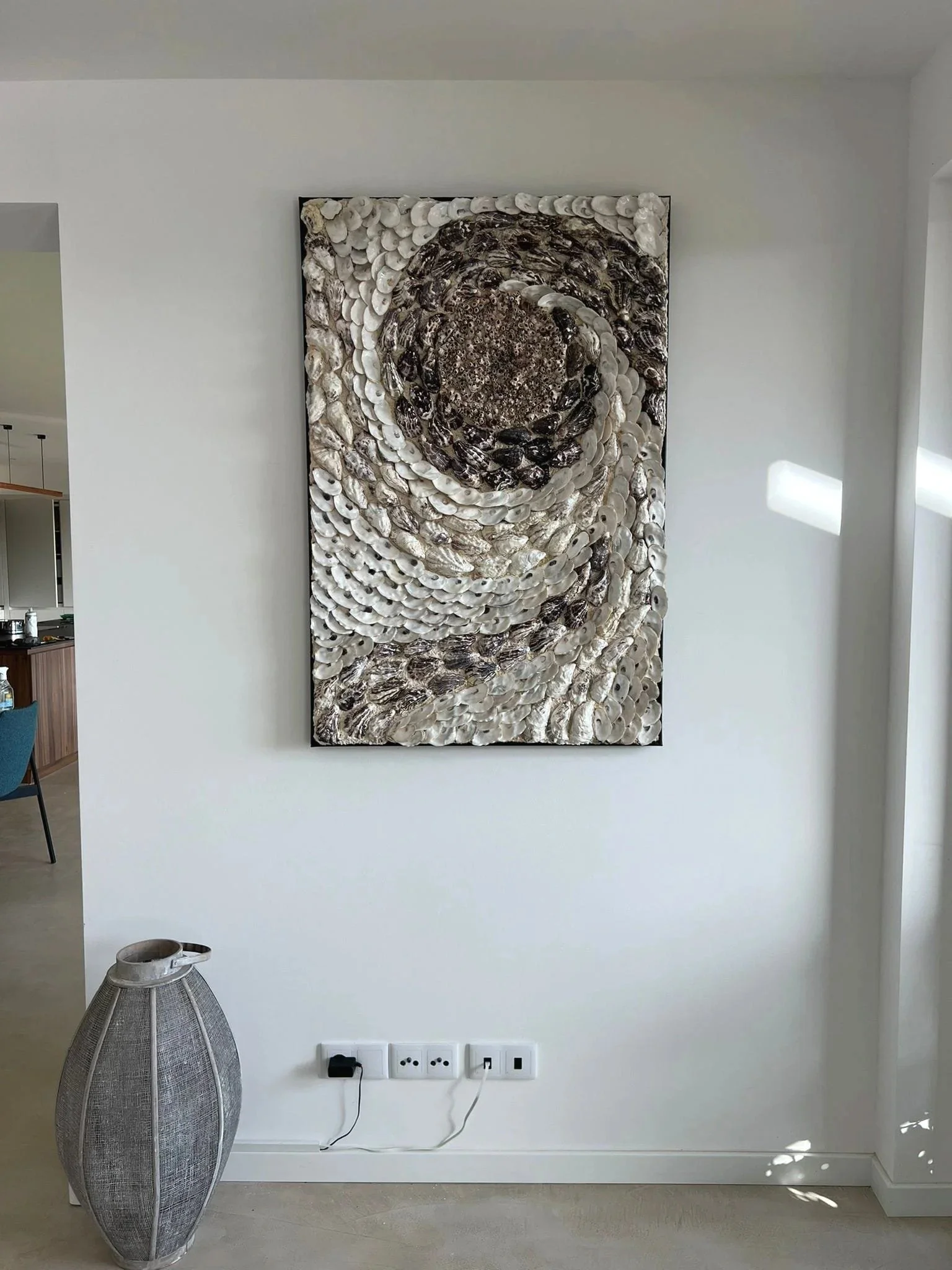 large oyster seashell wall art, minimalist contemporary living room, coastal home