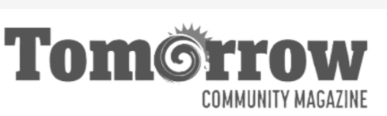 Logo for Tomorrow Community Magazine featuring the word 'Tomorrow' with a clock face incorporated into the 'o' and a sunburst above it.
