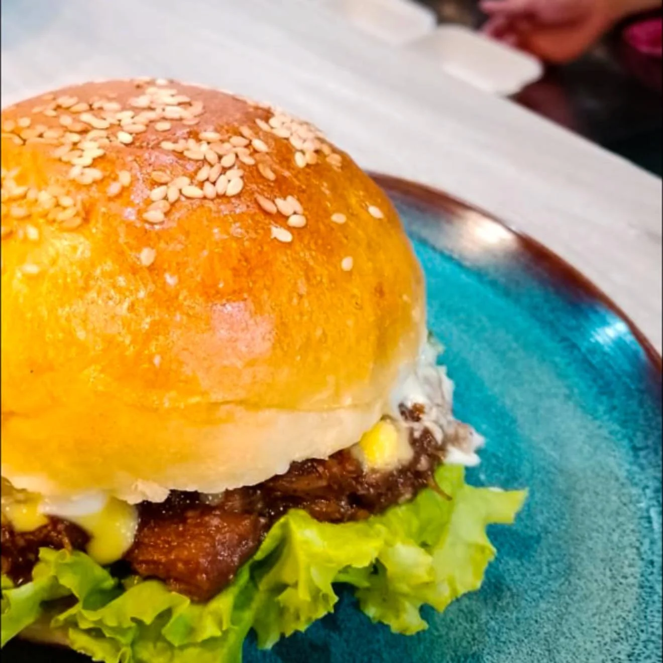 A juicy real beef patty, rich signature sauce, and oozy melted cheese in every bite, served on our soft homemade bun. This is comfort food done right&mdash;only at Spice Table 🍔✨

#delicious #arabic #MoroccanChicken #pizzanapoletana #recommended #ho