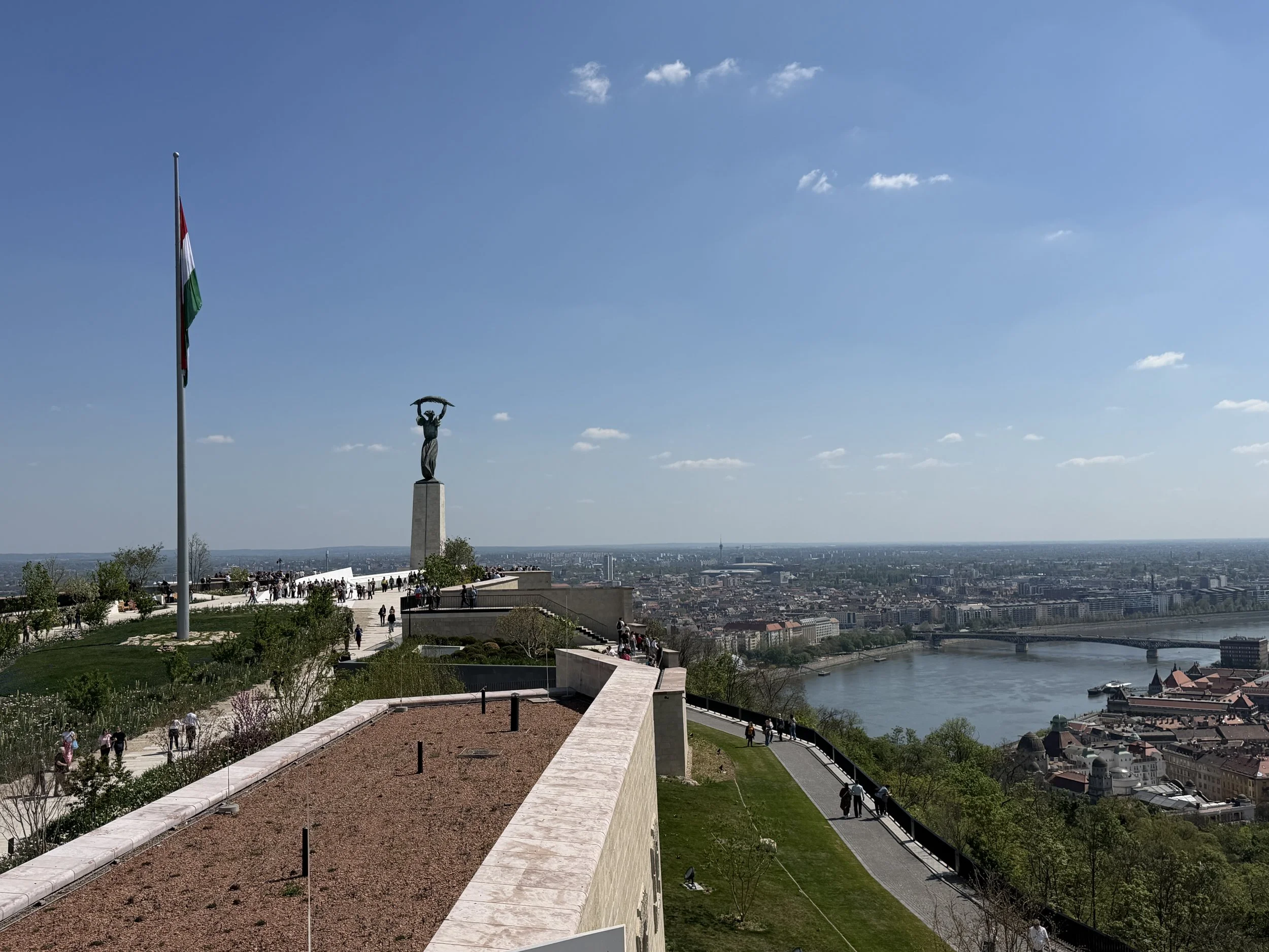 Panoramic views from the Citadella rooftop terrace with the Liberty Statue and Hungary's national flag, Budapest 2026