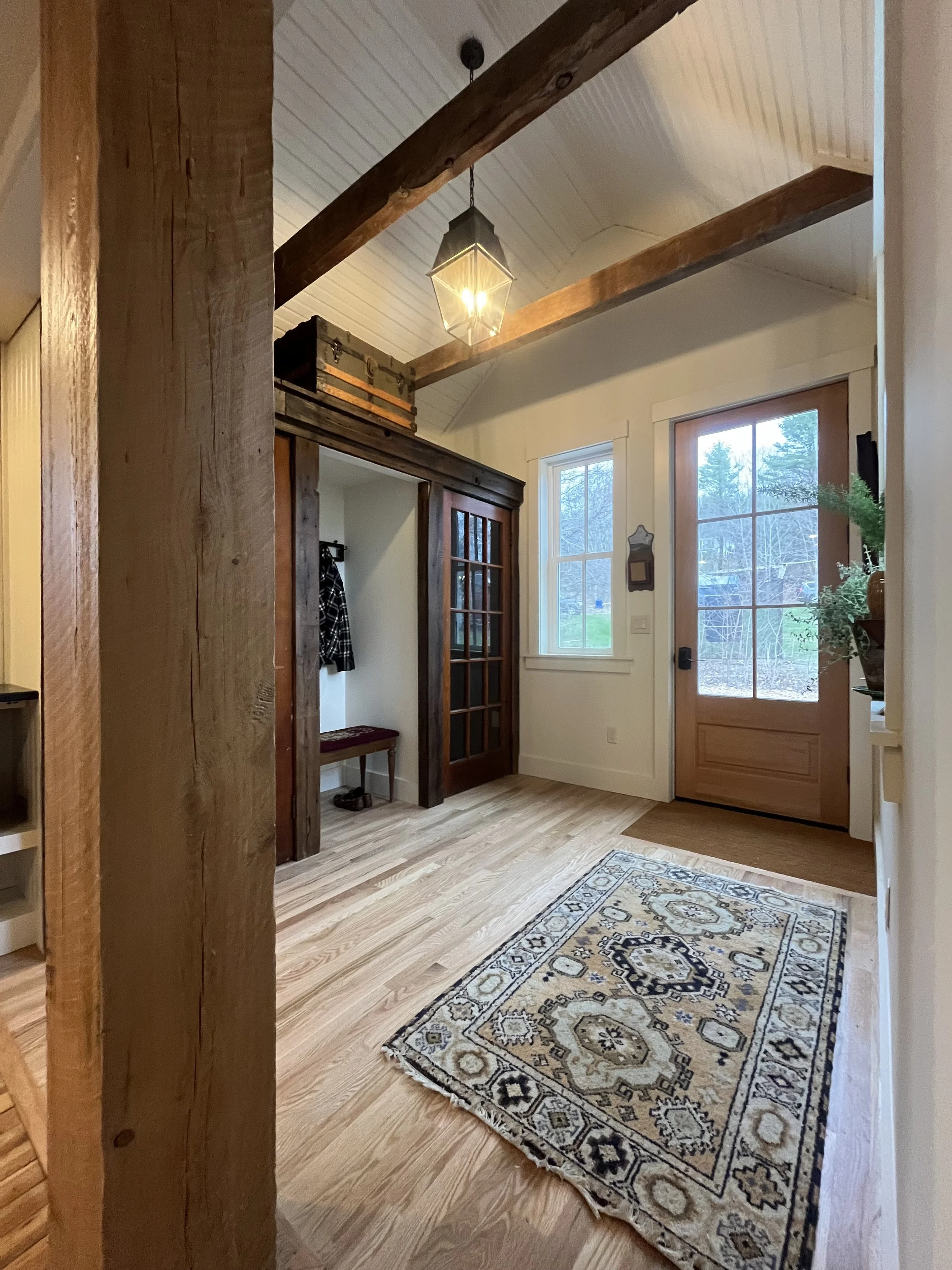Vintage Mudroom with rug and hanging light