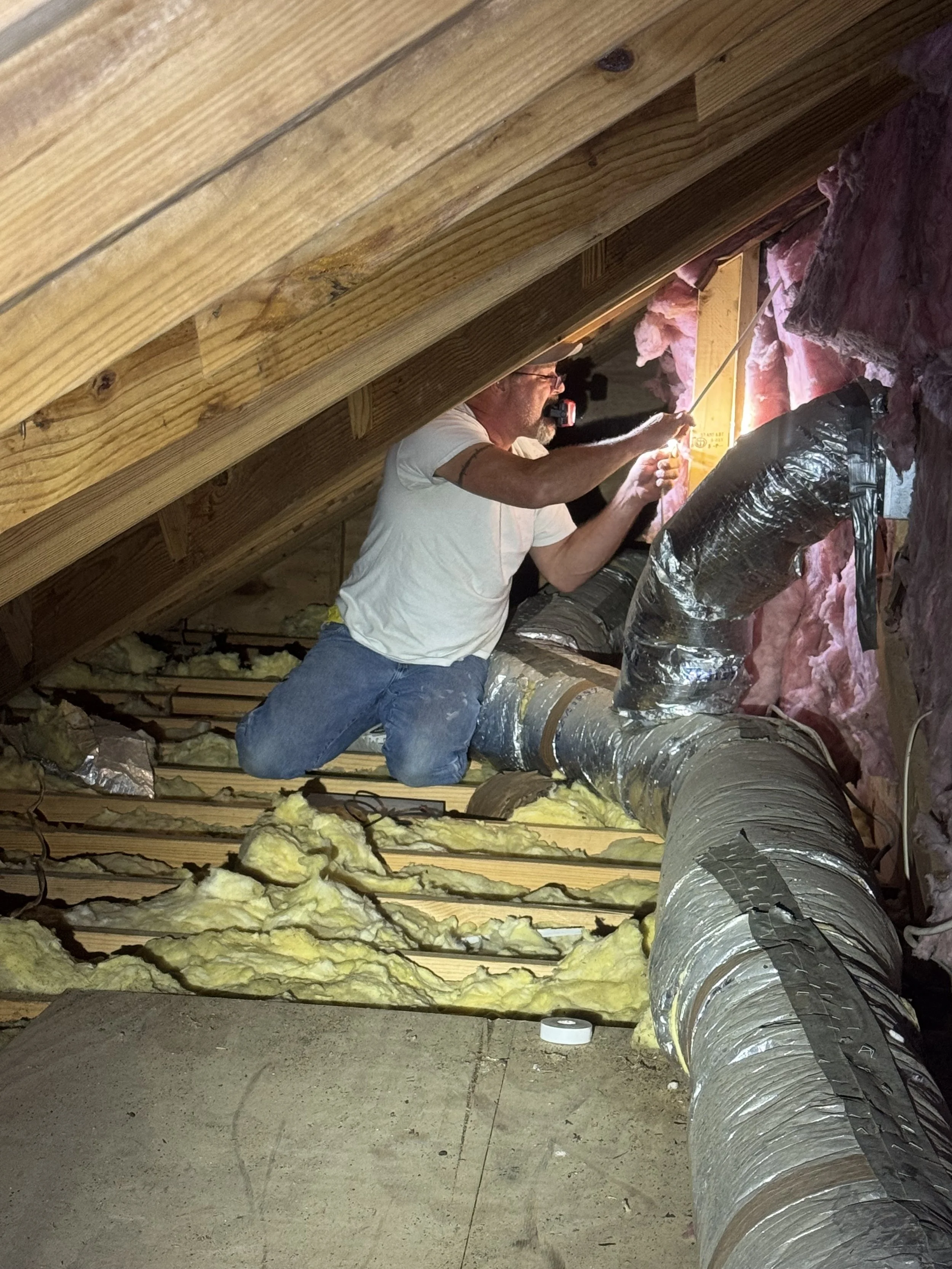 Electrician troubleshooting a residential electrical circuit in South Mississippi.