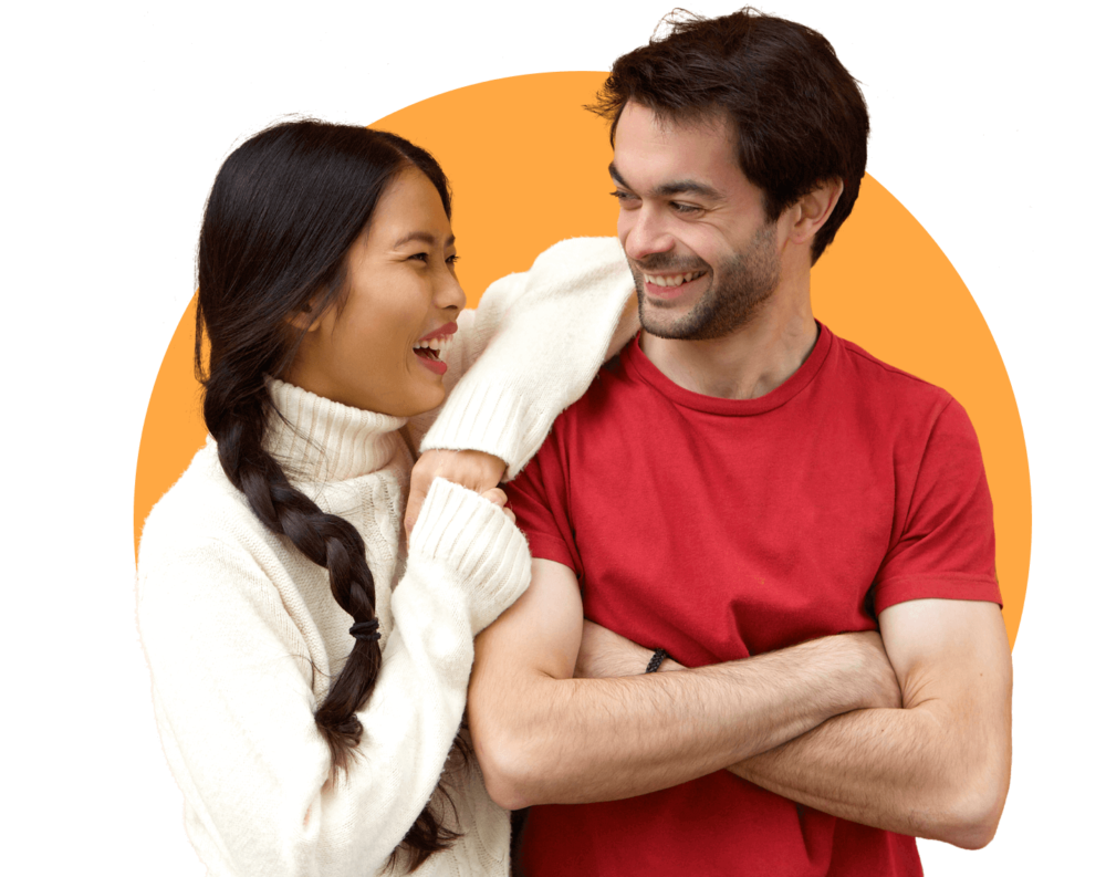 Photo of young adult couple laughing together