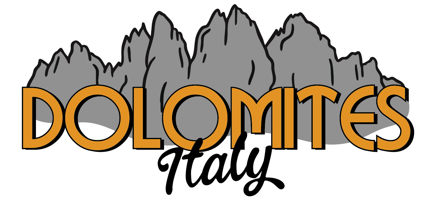 Illustration of gray mountains with the word Dolomites in large orange stylized letters in front.