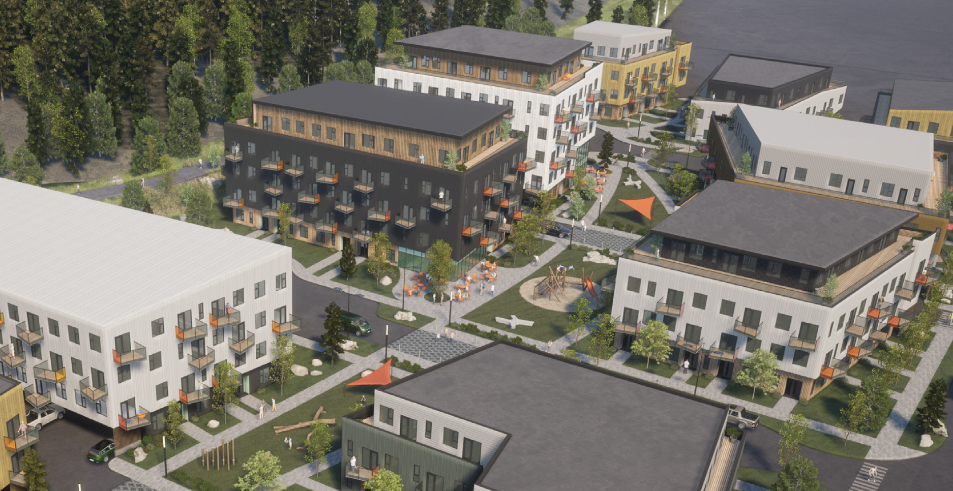 Aerial view of a modern apartment complex with several multi-story buildings, landscaped walkways, and a central courtyard with playground and seating areas, surrounded by trees.