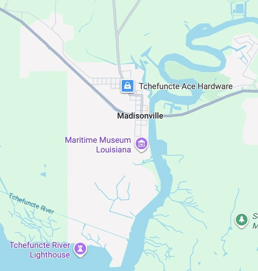 Map showing Madisonville, Louisiana, with landmarks including the Maritime Museum Louisiana, Tchefuncte River Lighthouse, and Tchefuncte Ace Hardware; the map also depicts the Tchefuncte River flowing southward.